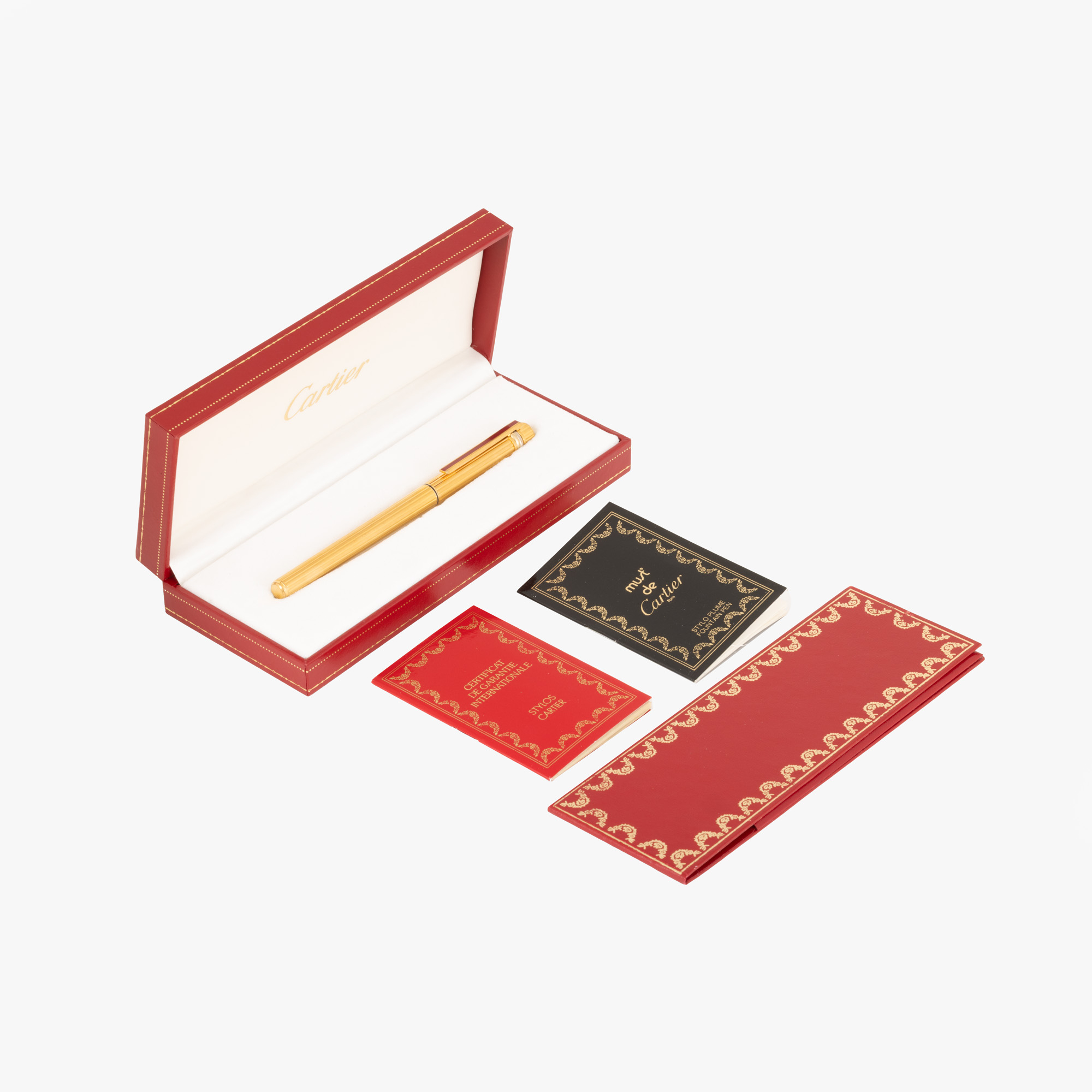 Stilou Cartier Must de Cartier Trinity, din oțel placat cu aur, cu peniță din aur, ediție limitată Red Clip, însoțit de cutia originală, certificat de garanție și revizie, manual de utilizare