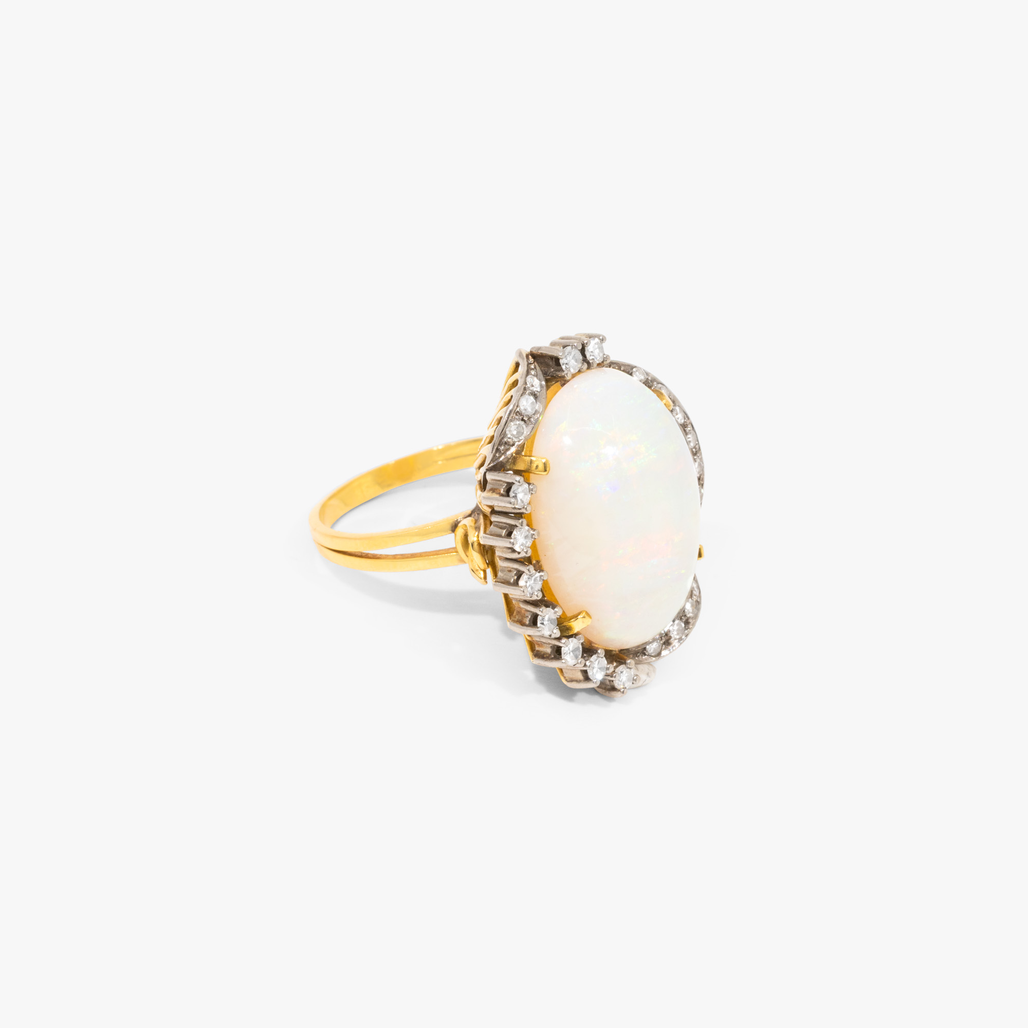 Bicolor gold ring, decorated with opal and diamonds, handmade