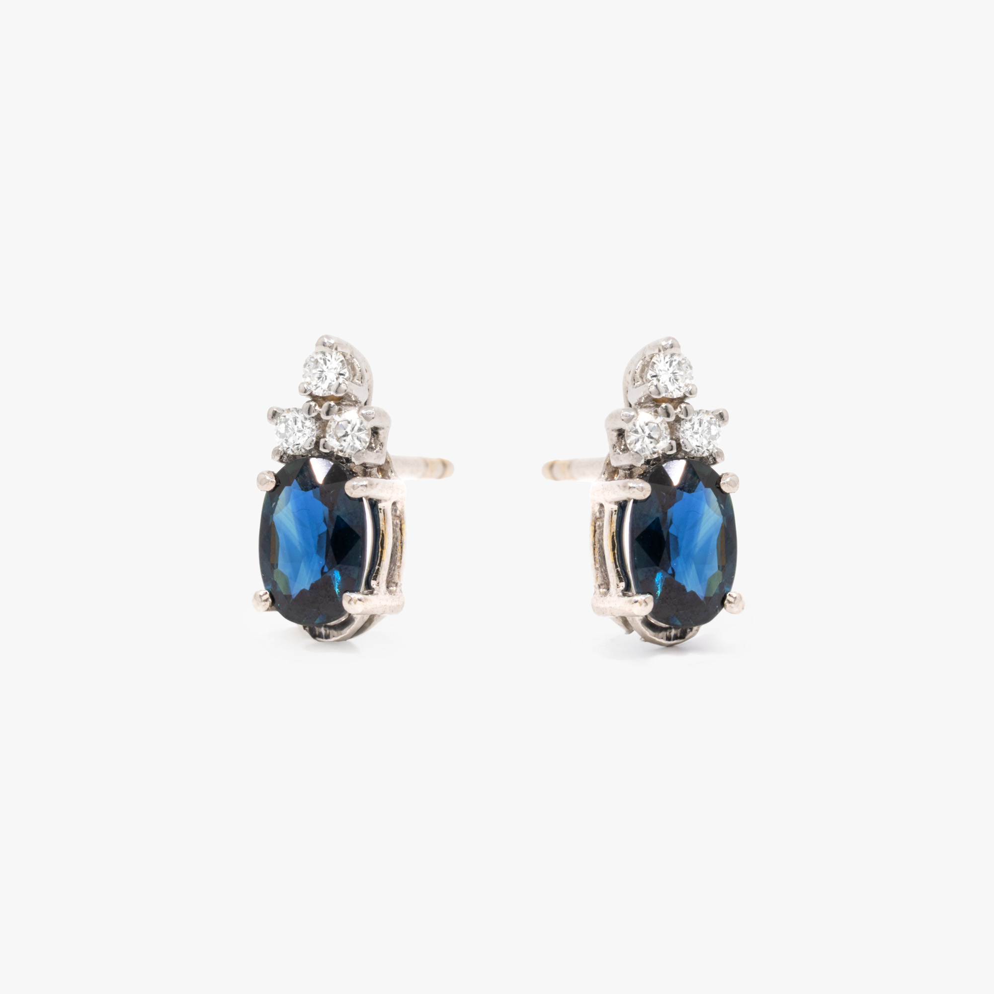 Pair of white gold earrings, adorned with sapphires and diamonds