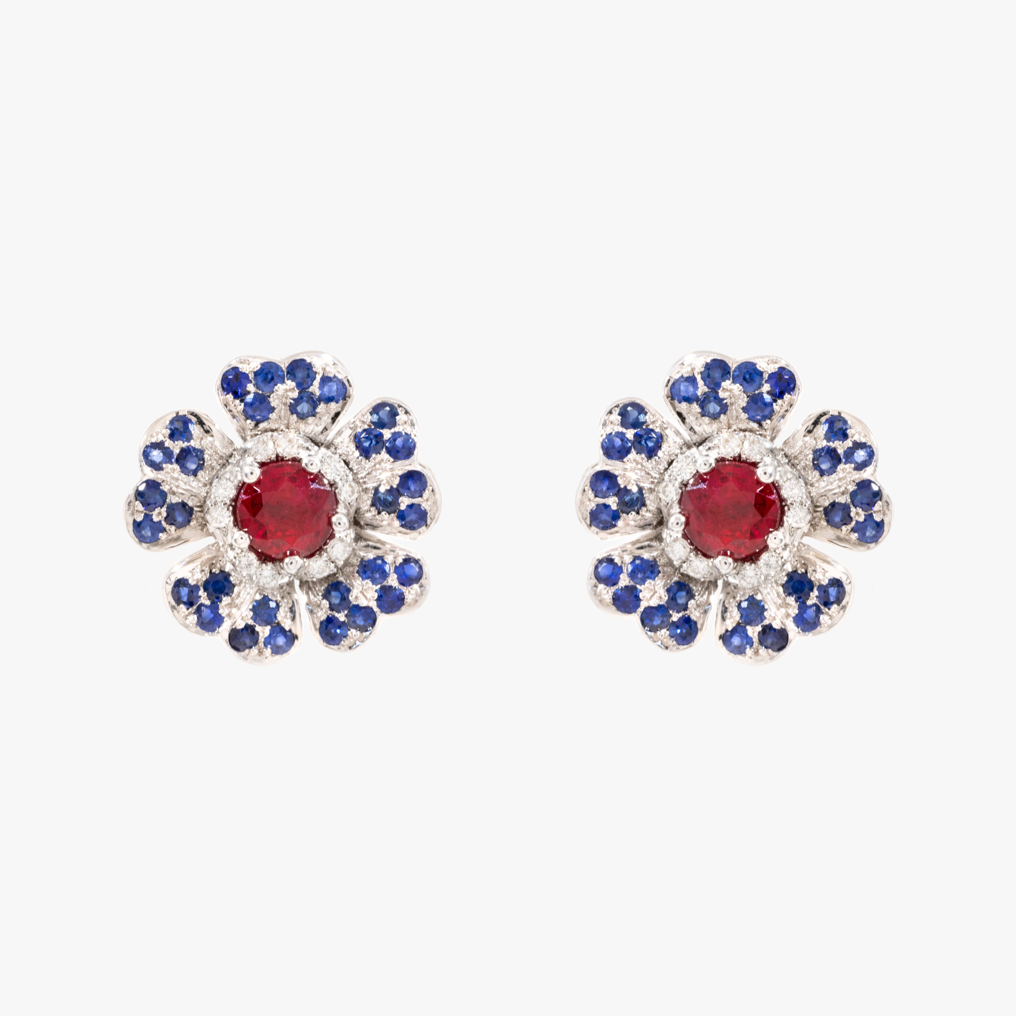 Pair of white gold earrings, decorated with diamonds, sapphires and rubies