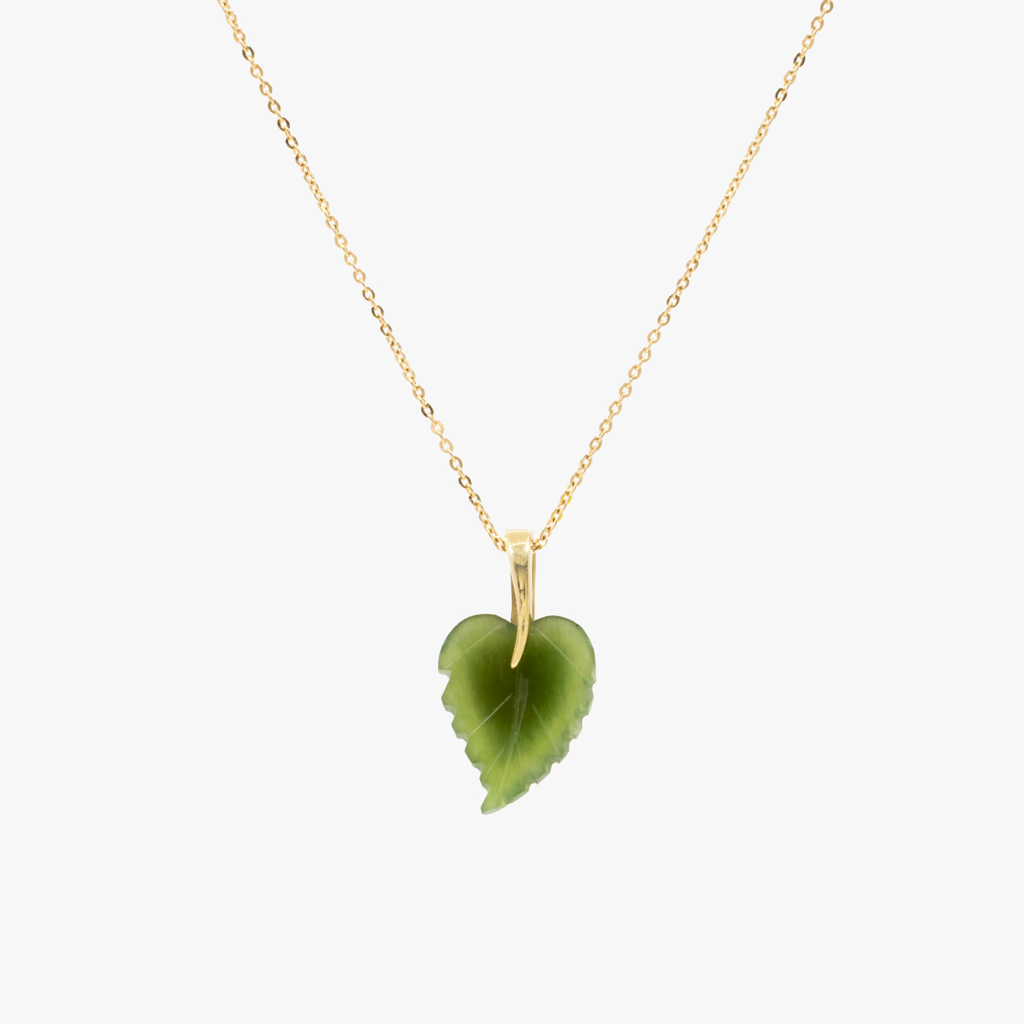 Gold chain with nephrite jade pendant