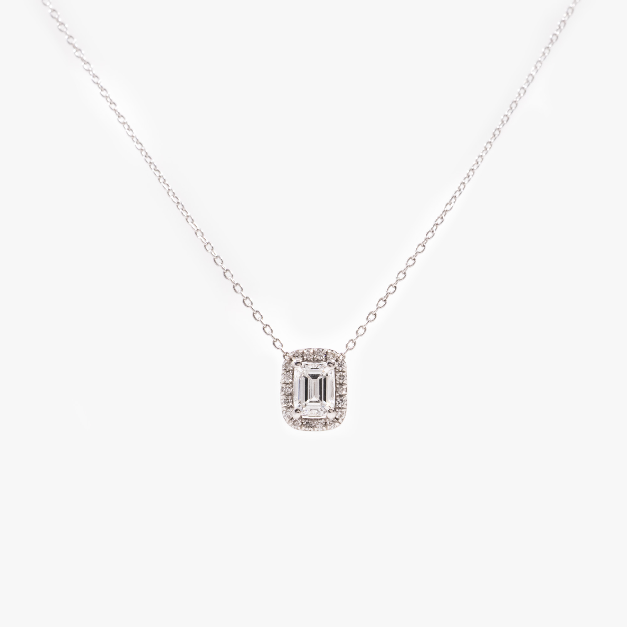 White gold necklace with diamond pendant, accompanied by additional gemological certificate