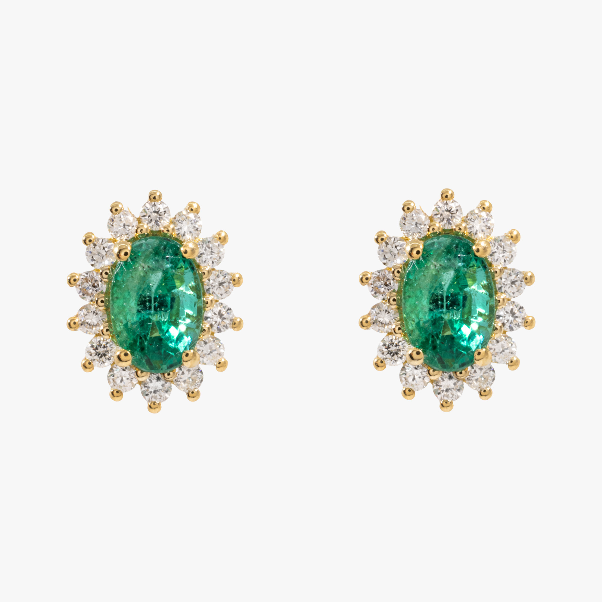 Pair of gold earrings, decorated with emeralds and diamonds