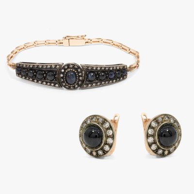 Gold and silver set, consisting of a pair of earrings and a bracelet, decorated with diamonds and sapphires