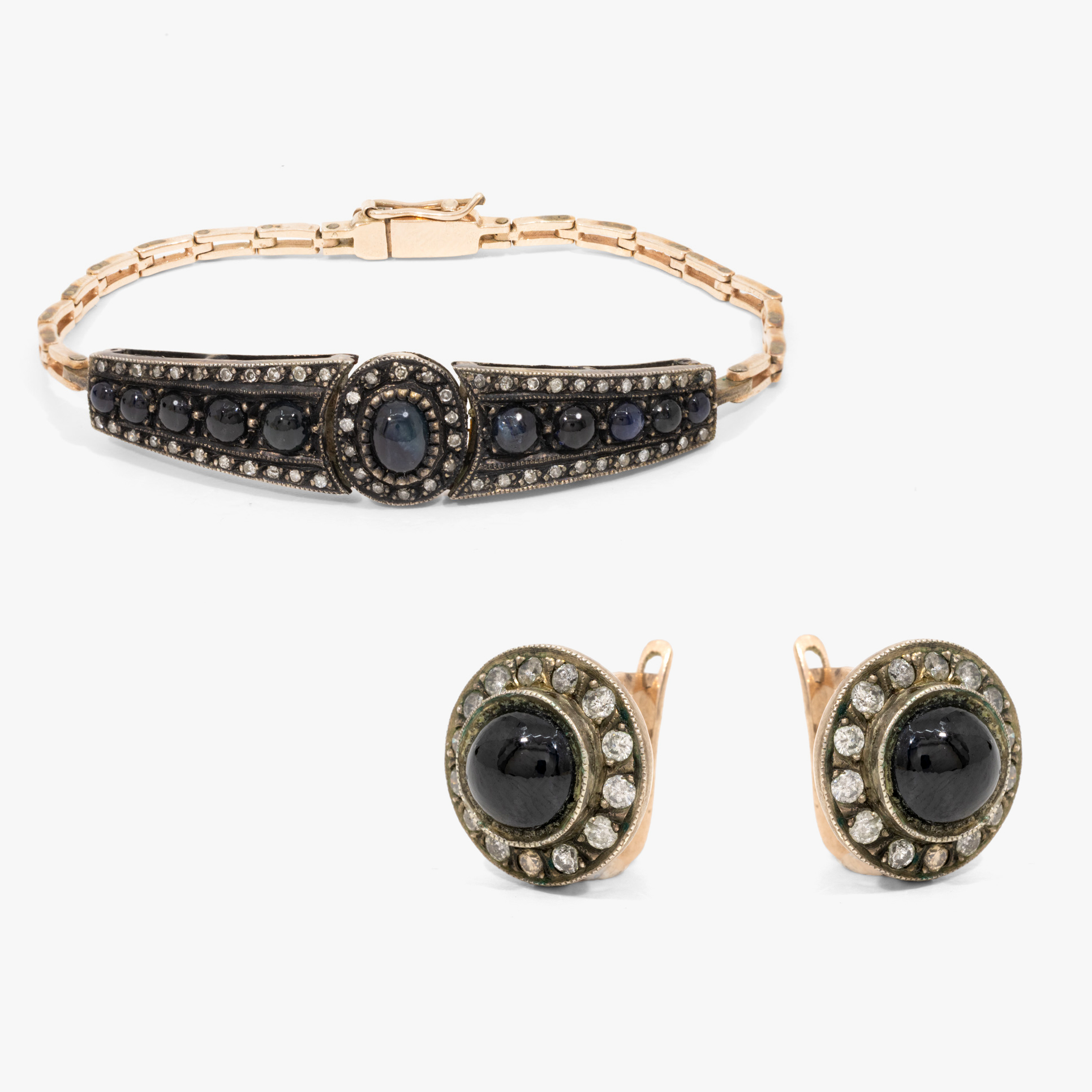 Gold and silver set, consisting of a pair of earrings and a bracelet, decorated with diamonds and sapphires
