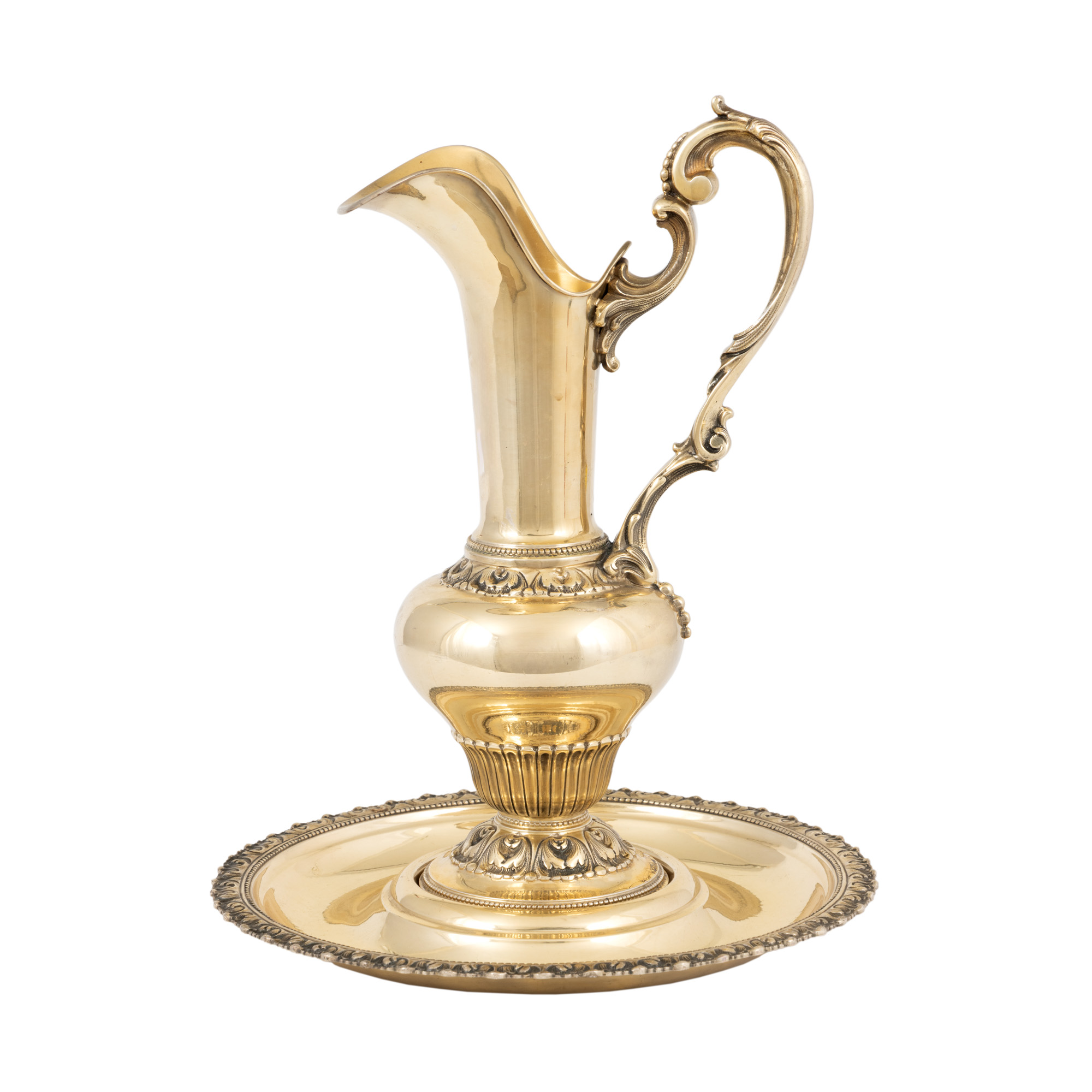 Set in Neo-Classical manner, consisting of pitcher and plate, made of gilded silver, approx. 1960