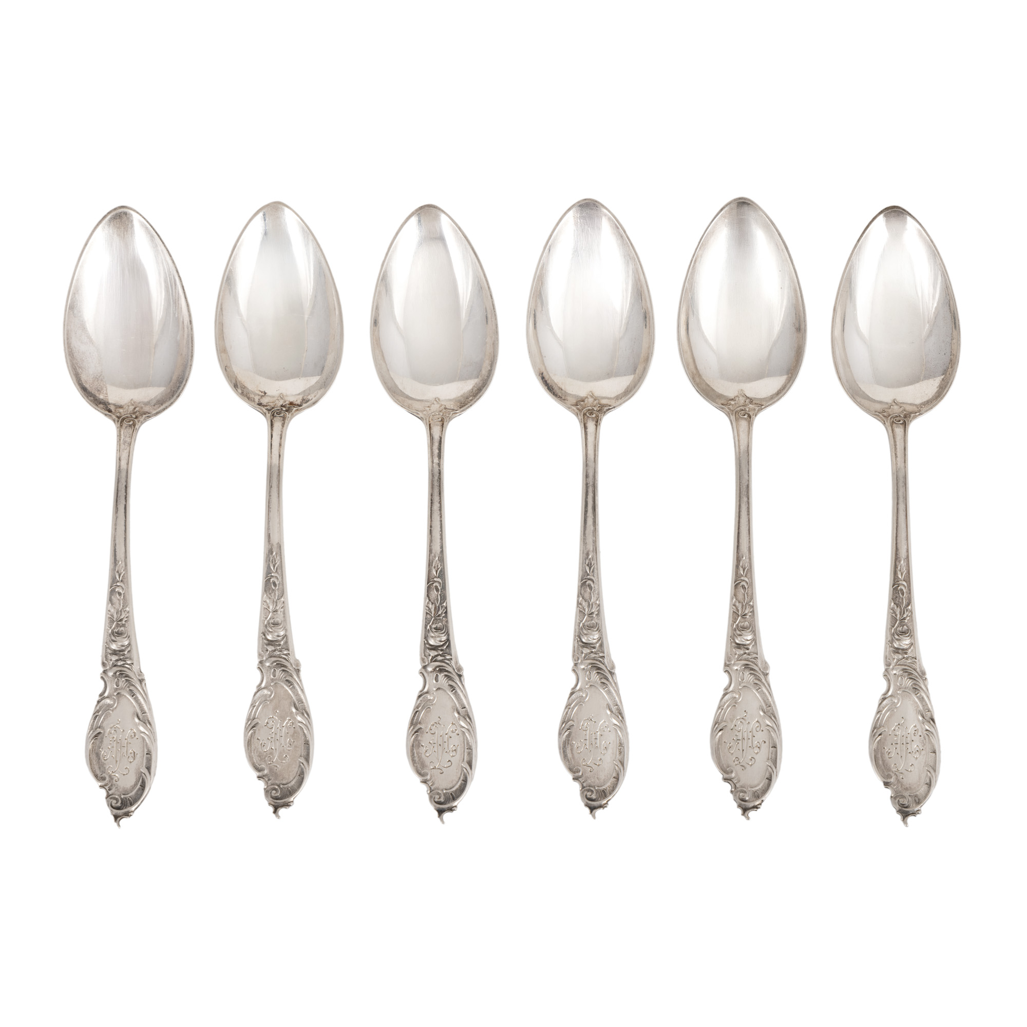 Set of six silver spoons, decorated with a floral pattern and the monogram "AH"
