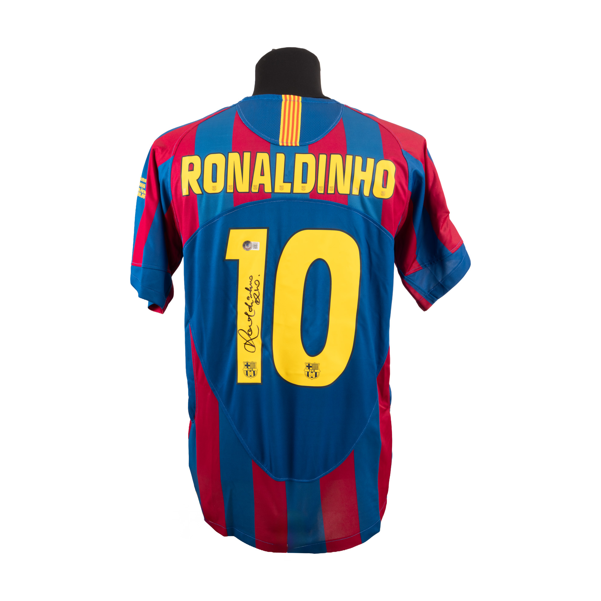 F.C. Barcelona T-shirt, with Ronaldinho's (Ronaldo de Assis Moreira) holographic signature, nicknamed "O Bruxo", framed