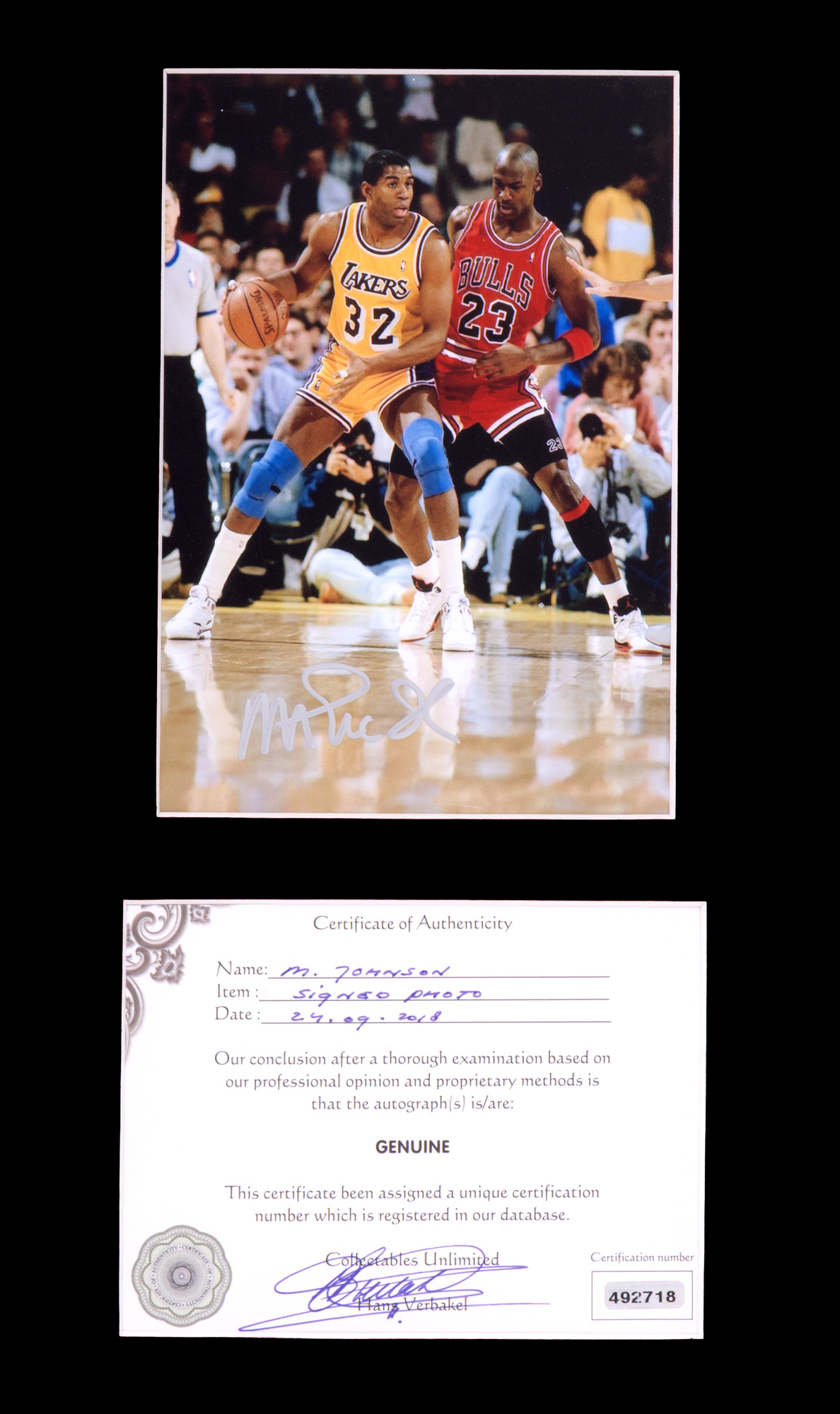 Photograph depicting Magic Johnson and Michael Jordan, with Magic Johnson's holographic signature, accompanied by a certificate of authenticity, framed