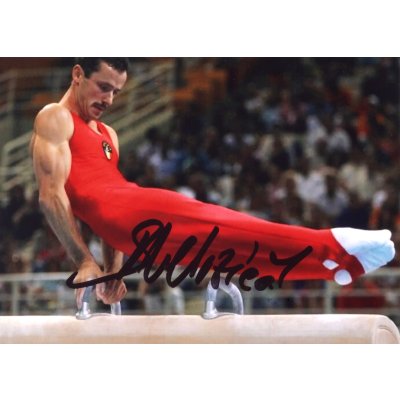 Photograph of Marius Urzica during the pommel horse exercise, with the athlete's handwritten signature, framed