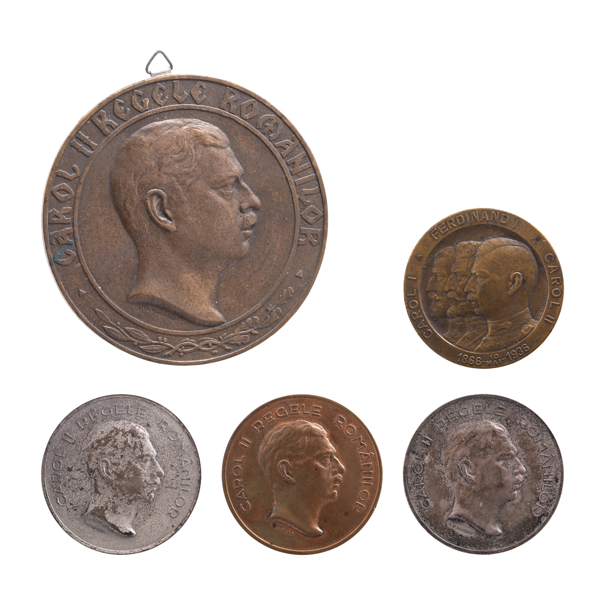 Lot format din machetă originală ”Carol II Regele Românilor”, gravor Emil Wilhelm Becker, cca. 1933, avers, exemplar unic, medalie ”Carol II Regele Românilor”, gravor Emil Wilhelm Becker, 1937, medalie ”Carol I, Ferdinand I, Carol II, 10 mai 1866 - 10 mai 1936”, gravor Emil Wilhelm Becker, 1937, medalie ”Carol II Regele Românilor”, gravor Emil Wilhelm Becker, 1937 și medalie ”Carol II Regele Românilor”, gravor Emil Wilhelm Becker, 1937