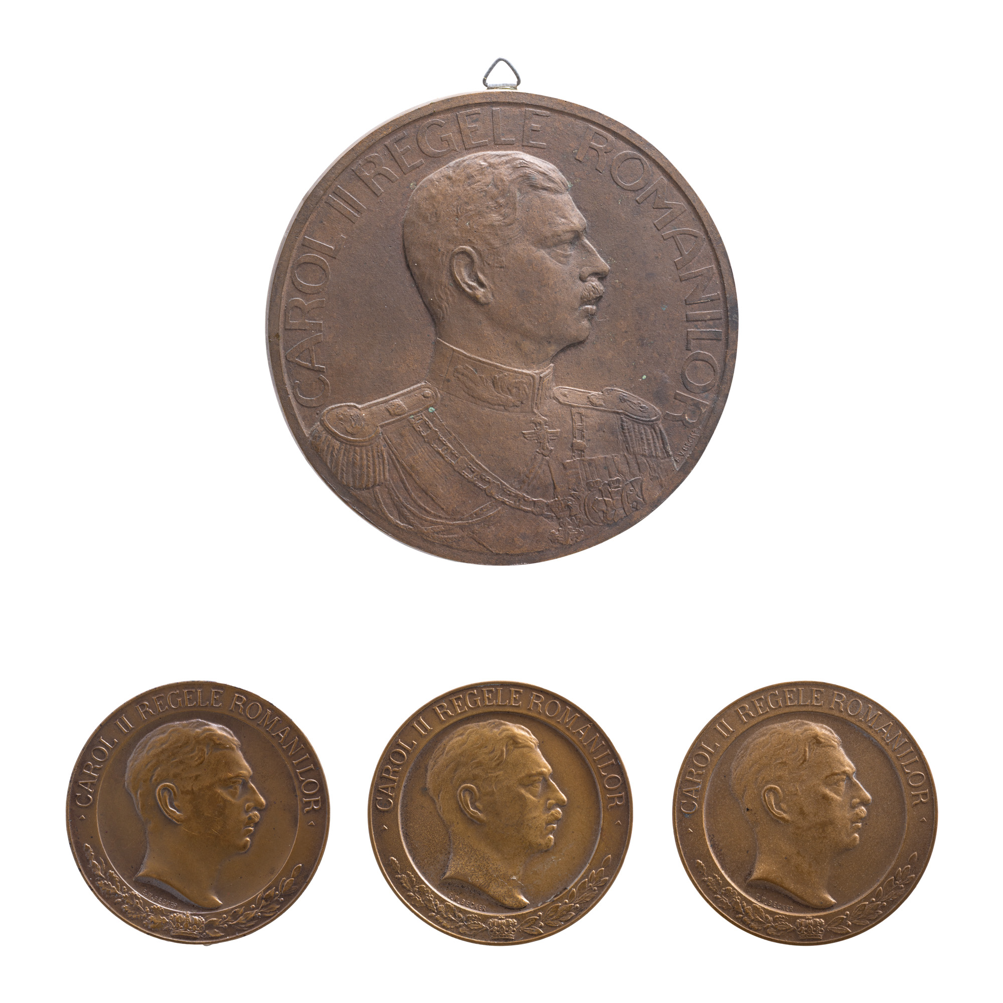 Lot format din machetă originală ”Carol II Regele Românilor”, gravor Emil Wilhelm Becker, cca. 1933, avers, exemplar unic, medalie ”Congresul și expoziția de numismatică, medalistică și arheologie”, gravori Emil Wilhelm Becker și R. Fässler, 1933, medalie ”Luna Bucureștilor, 9 mai - 9 iunie 1935”, gravor Emil Wilhelm Becker, 1935, și medalie ”Societatea numismatică română, augustului președinte de onoare regele Carol II”, gravor Emil Wilhelm Becker, 1930