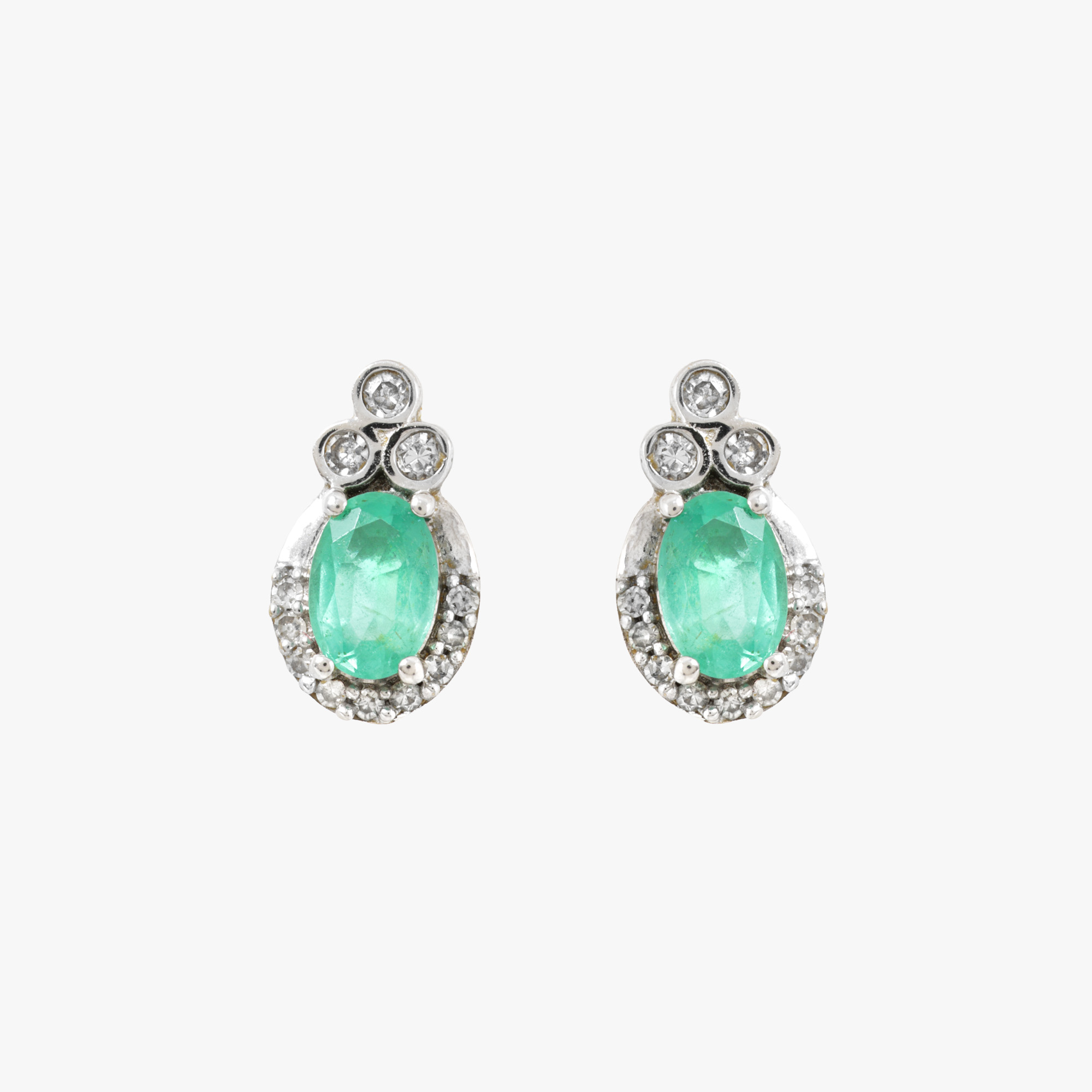 Pair of white gold earrings, decorated with emeralds and diamonds