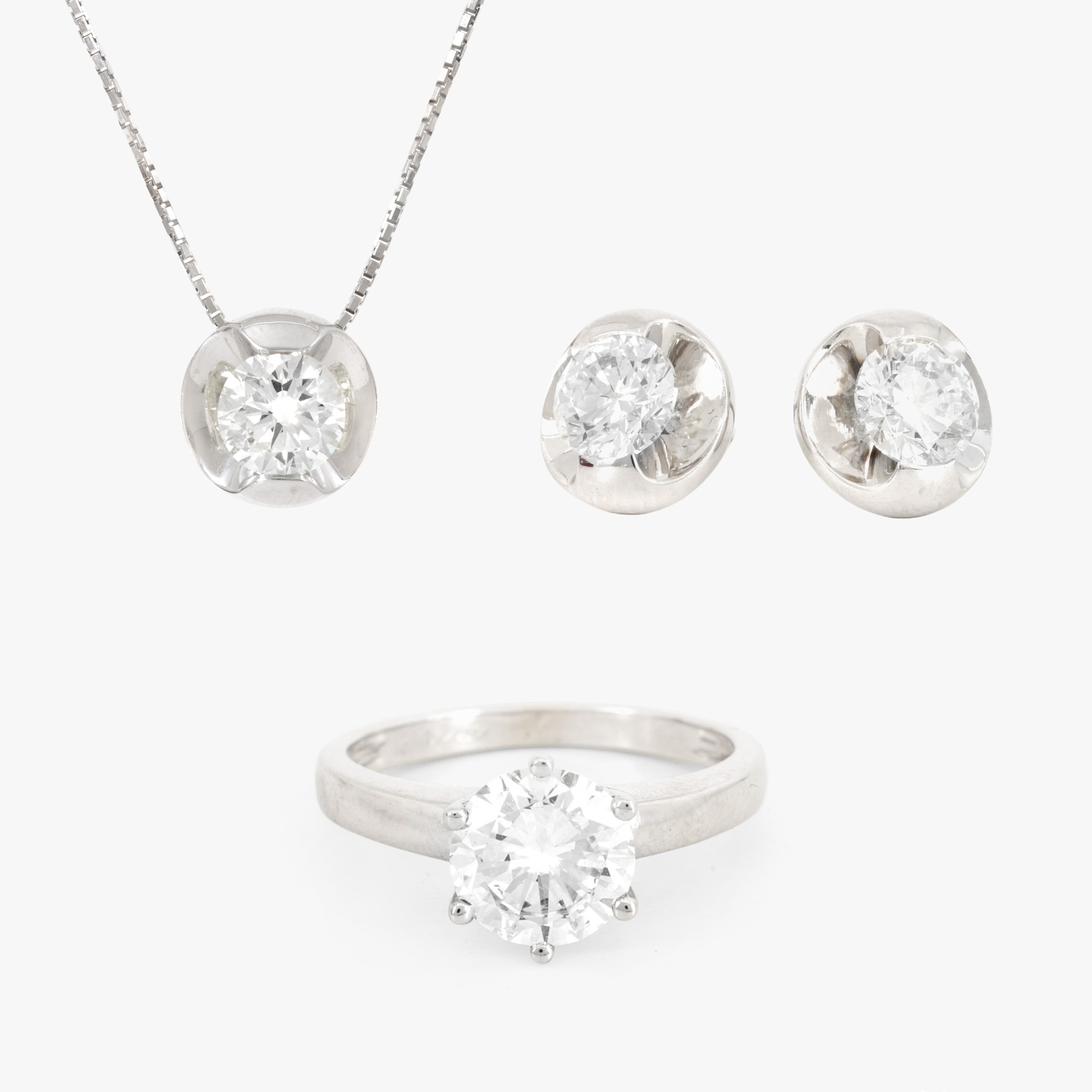 Cellini Set, in white gold, made up of a chain with pendant, earrings, and ring, decorated with diamonds