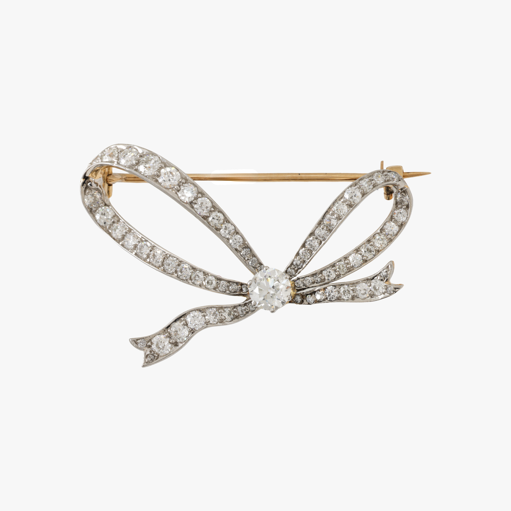 Tiffany & Co. gold and platinum brooch in the shape of a bow, decorated with diamonds, circa 1950