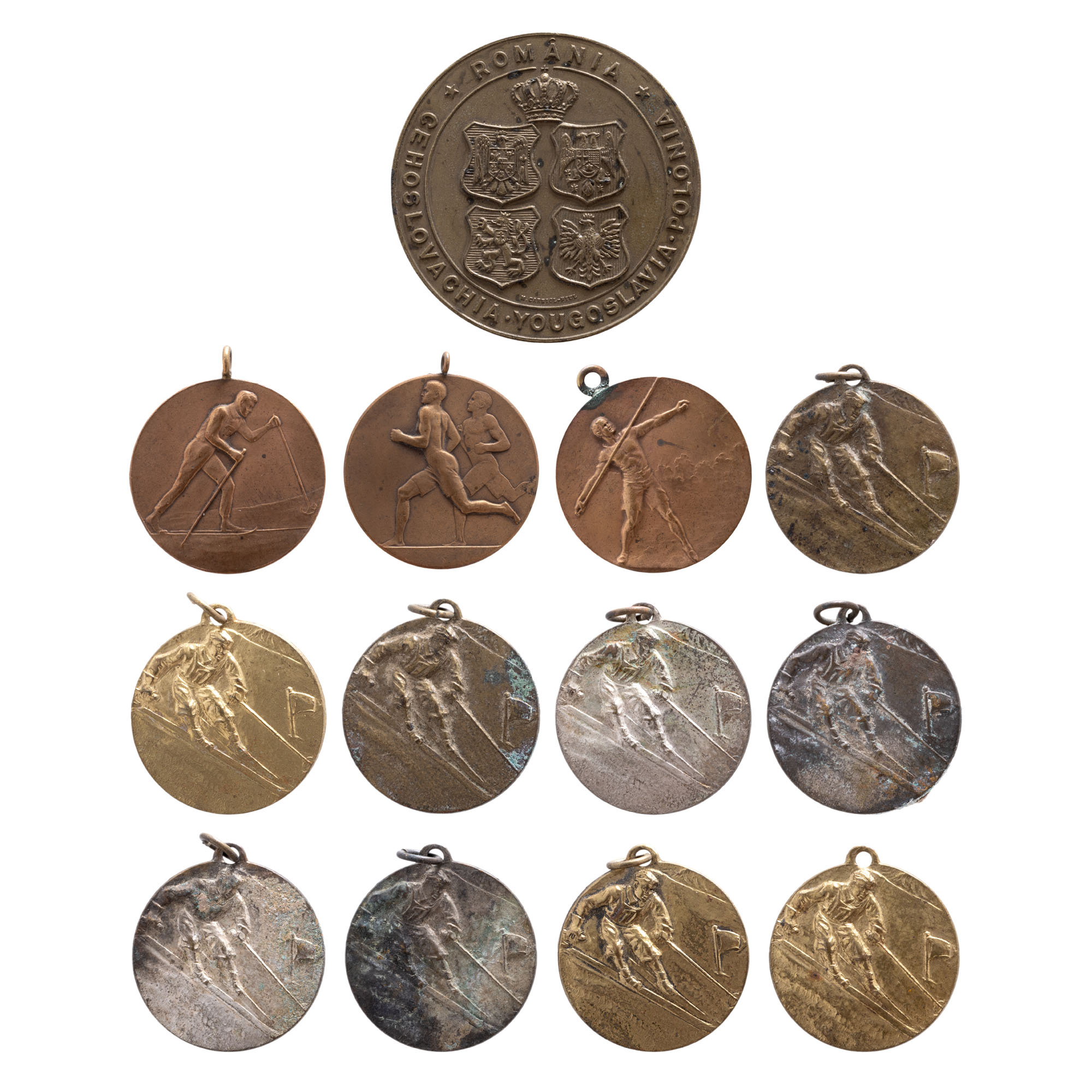 Lot consisting of "Spear Throwing" medal, "International Military Competition in Romania" medal, engraver Carniol son, 1934, "Third Athletics Championship" medal, 1924, and ten "Ski Federation" martisoare, circa 1944.