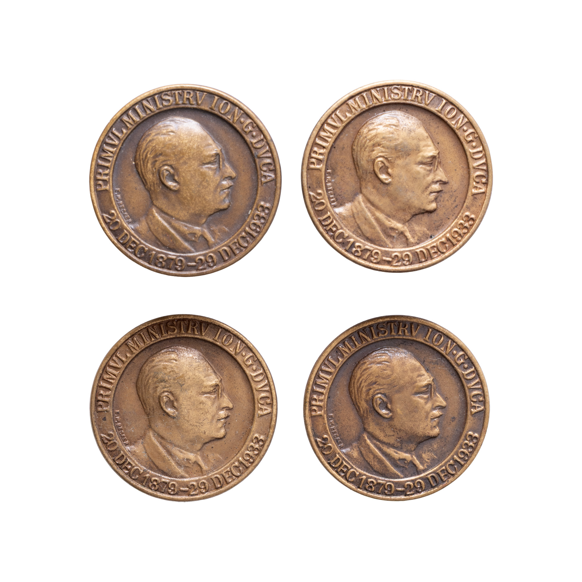 Lot format din patru insigne comemorative I.G. Duca