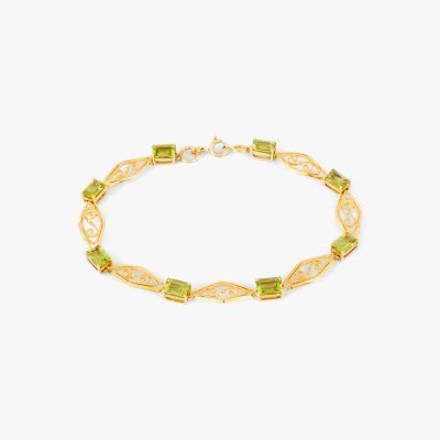 Art Nouveau-style gold bracelet decorated with peridots