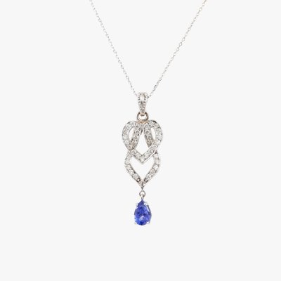 Gold necklace with pendant, decorated with diamond pavement and tanzanite