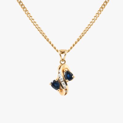 Yellow gold chain with pendant decorated with diamonds and sapphires