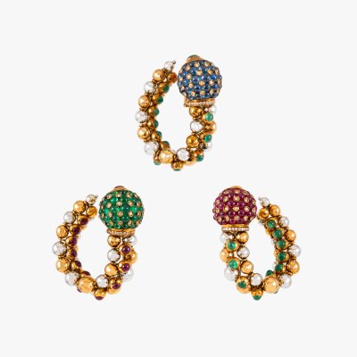 Set of three bicolor gold earrings, decorated with sapphires, rubies, emeralds and diamonds