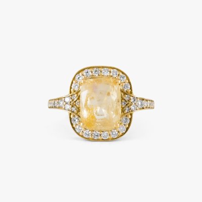 Gold ring, decorated with diamonds and a central yellow sapphire, accompanied by additional gemological certificates
