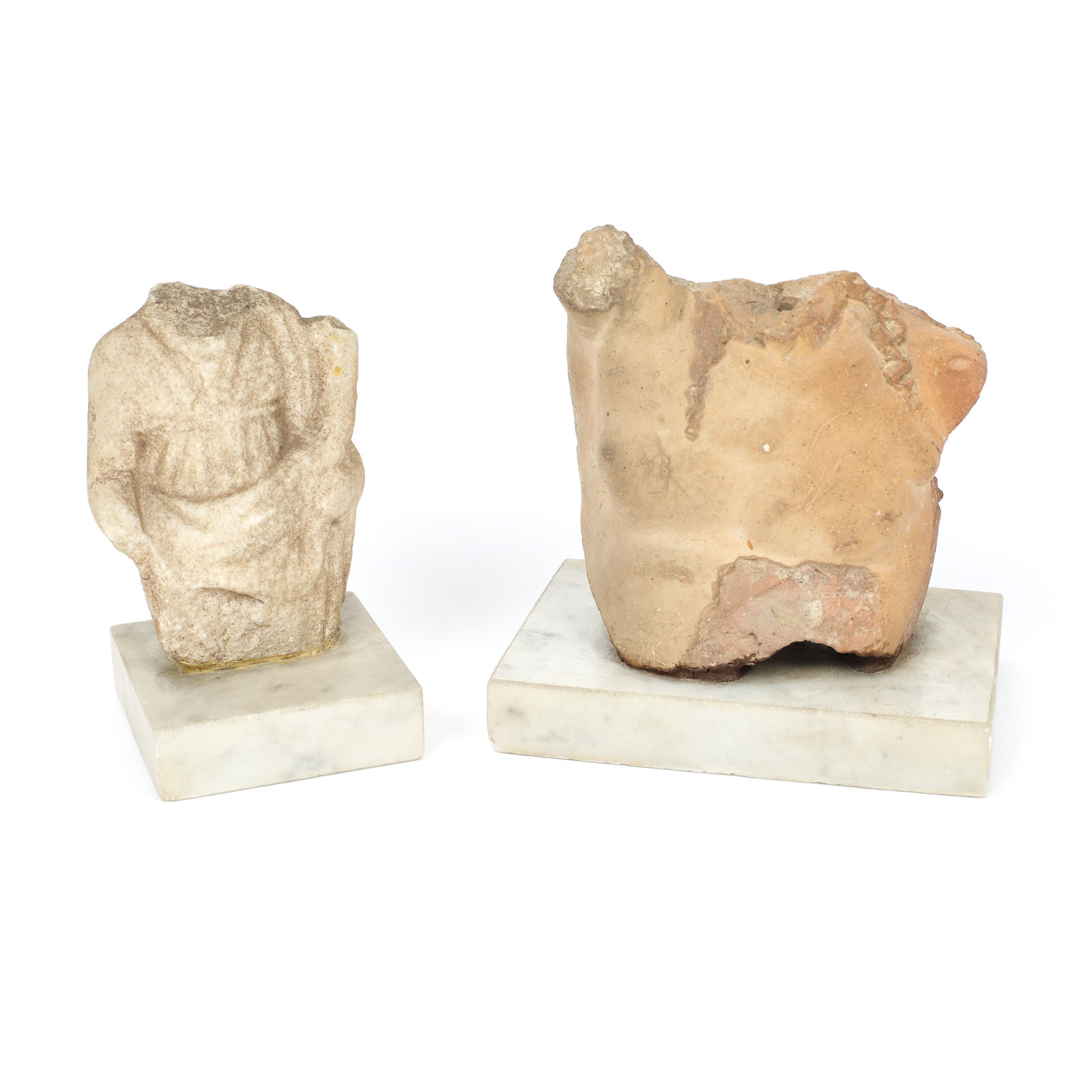 Set of a terracotta torso illustrating Dionysos and a marble fragment illustrating Tyche, governing goddess of fortune, Roman period, from the collection of dr. Horia Slobozianu