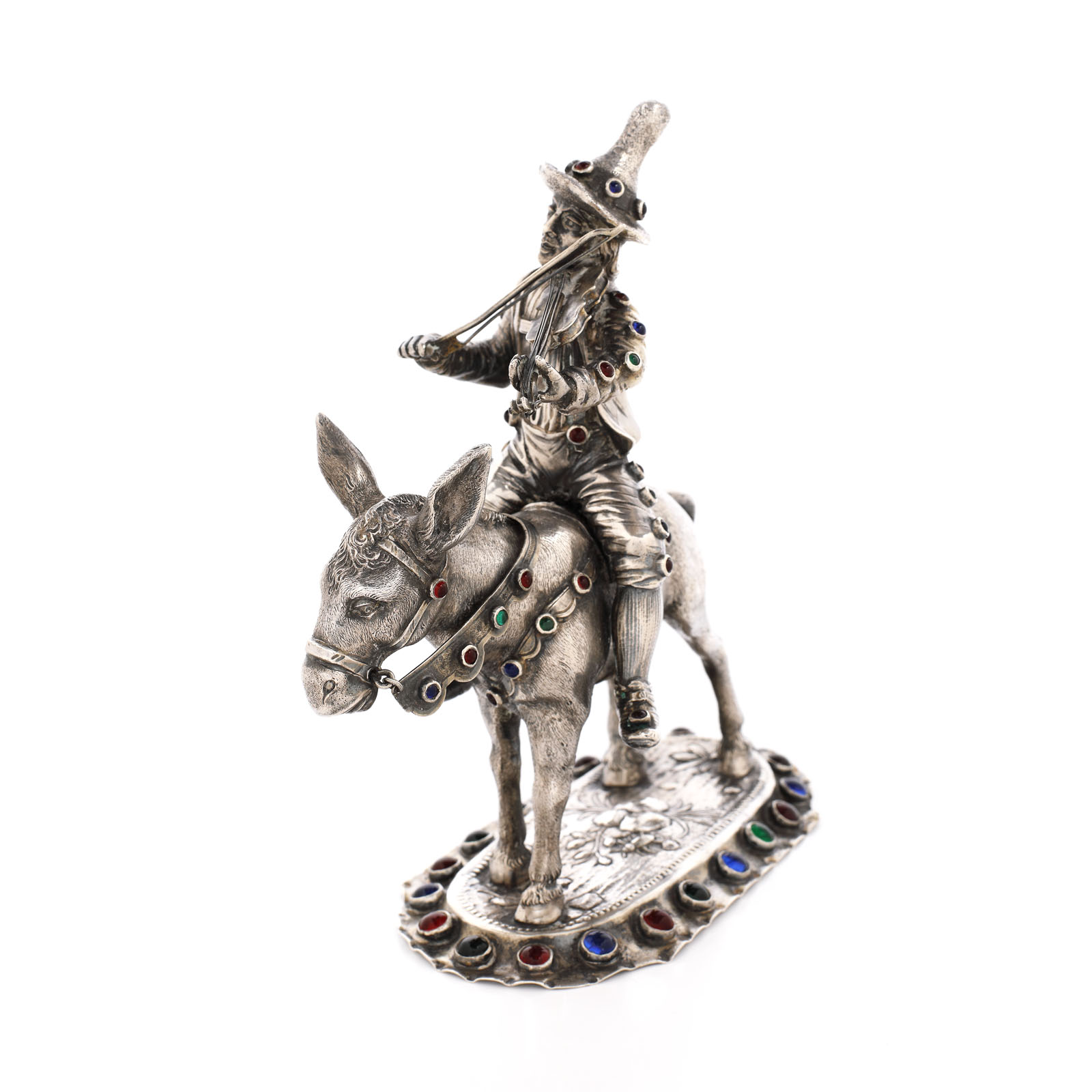 A decorative statuette made of Ludwig Neresheimer silver illustrating a violonist riding a small donkey, decorated with ornamental stones, approx. 1901-1921