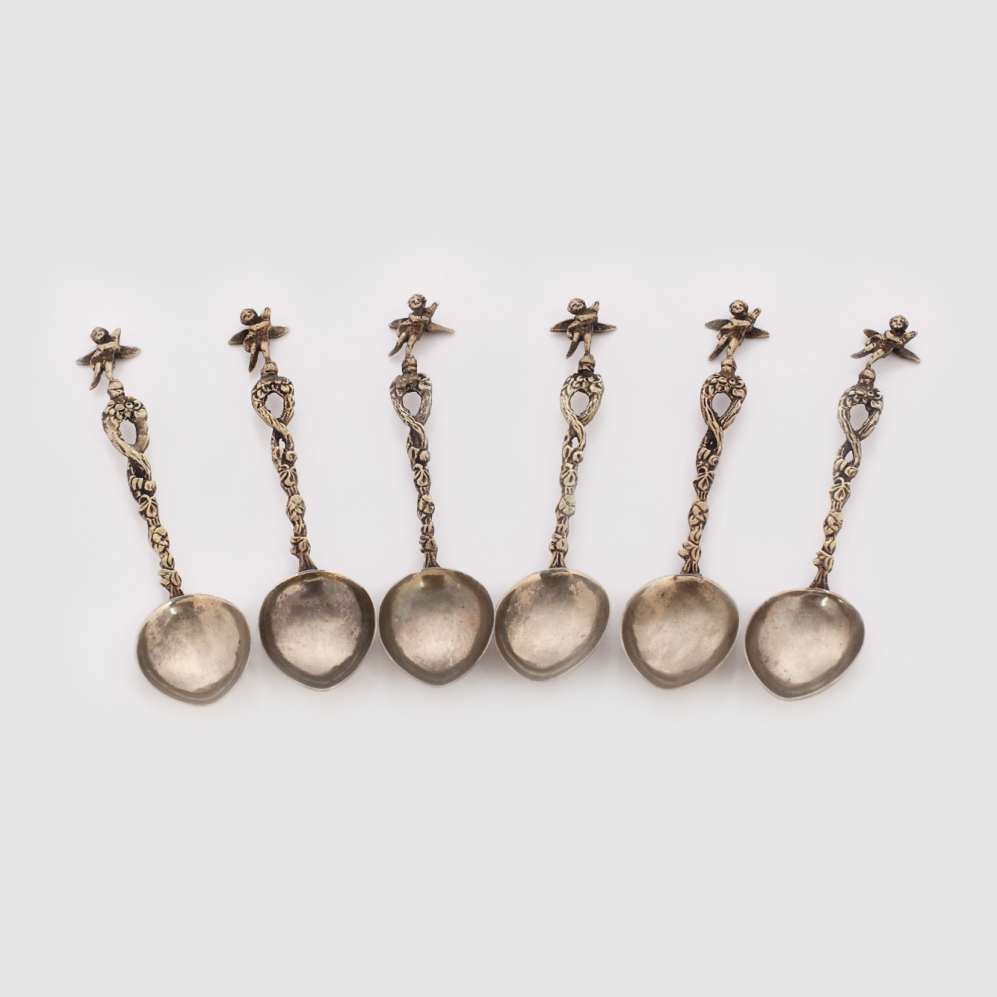 Set format din 6 lingurițe argintate, decorat cu putti, 1910-1920