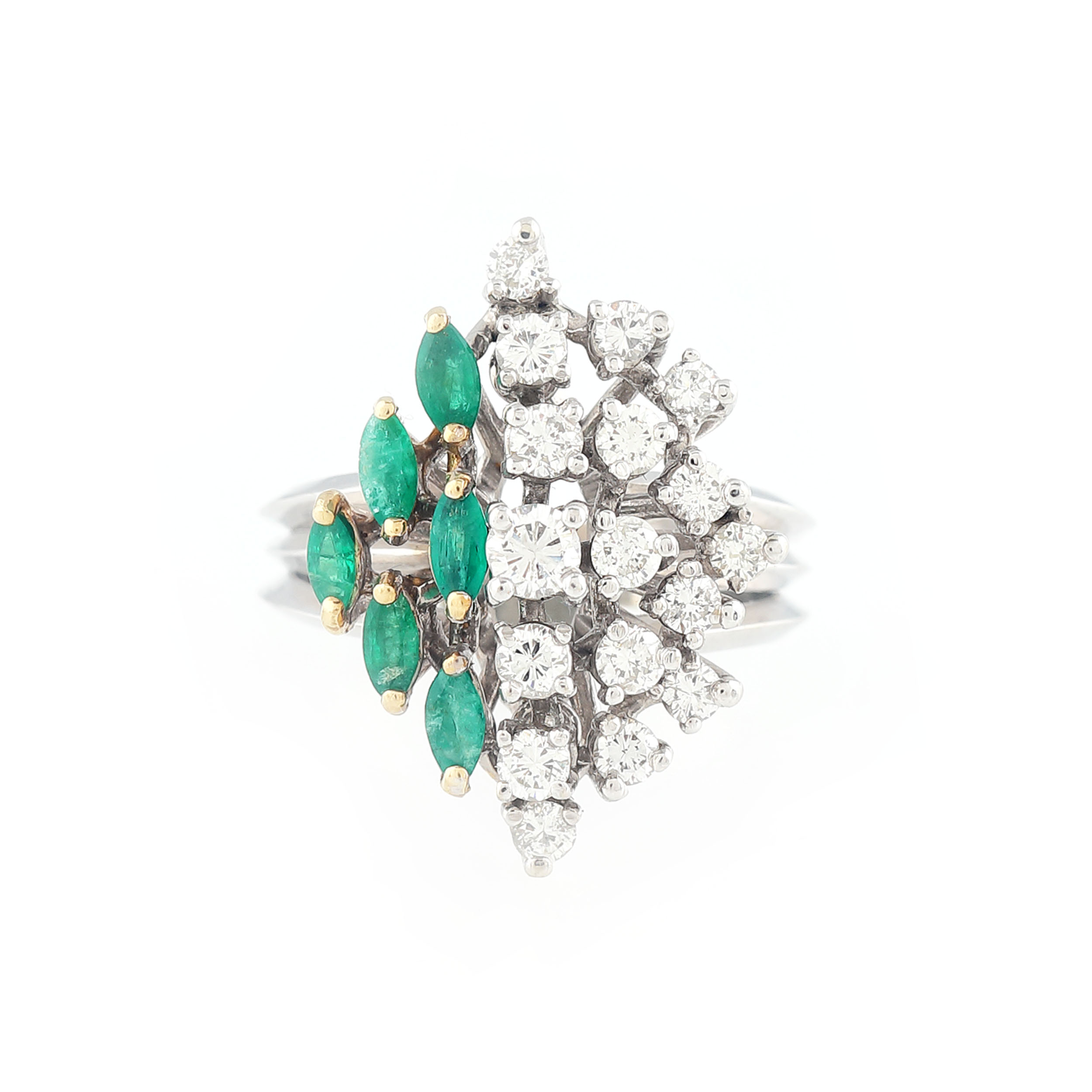 Luxurious gold ring, decorated with diamonds and emeralds