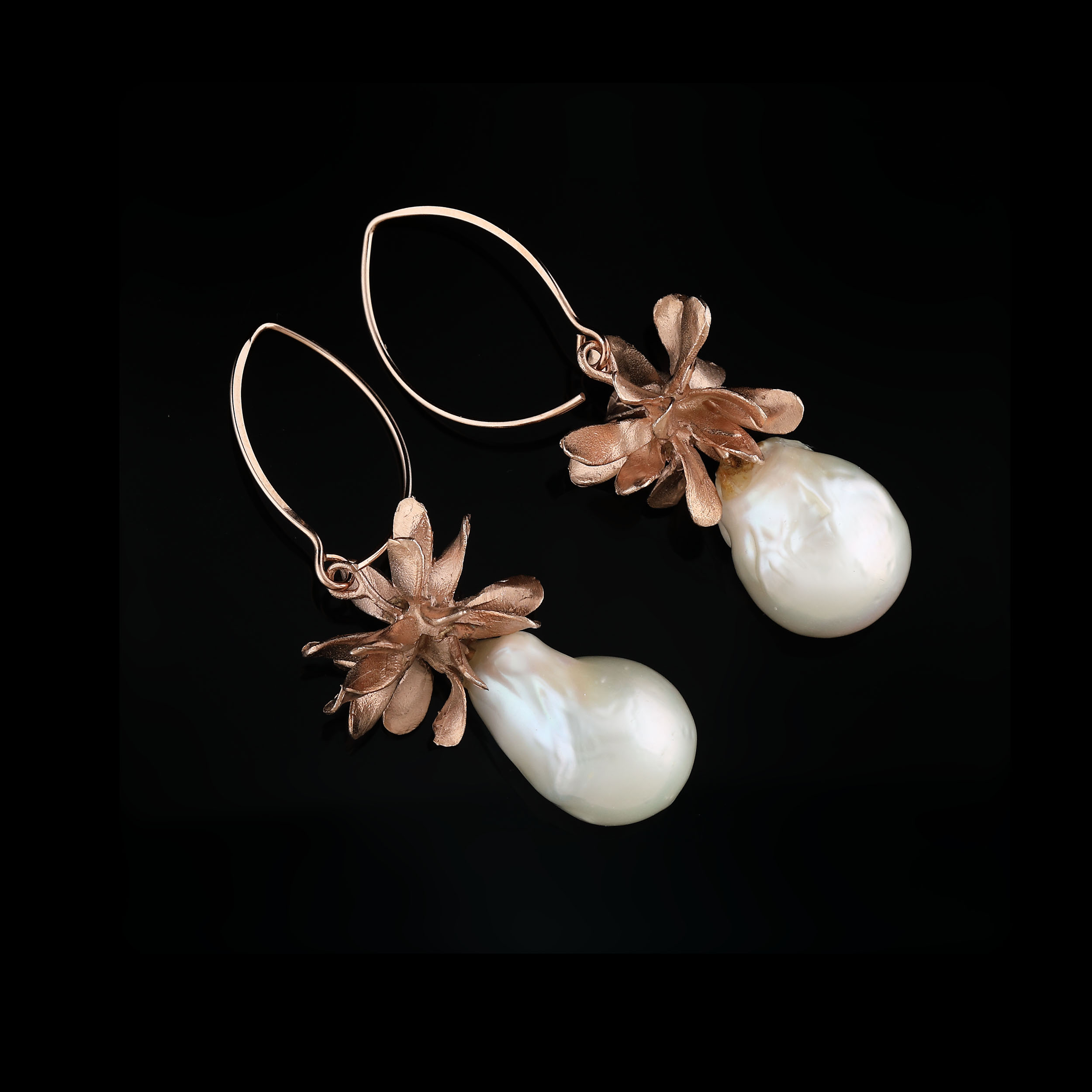 A pair of gold-plated silver earrings, decorated with baroque pearls