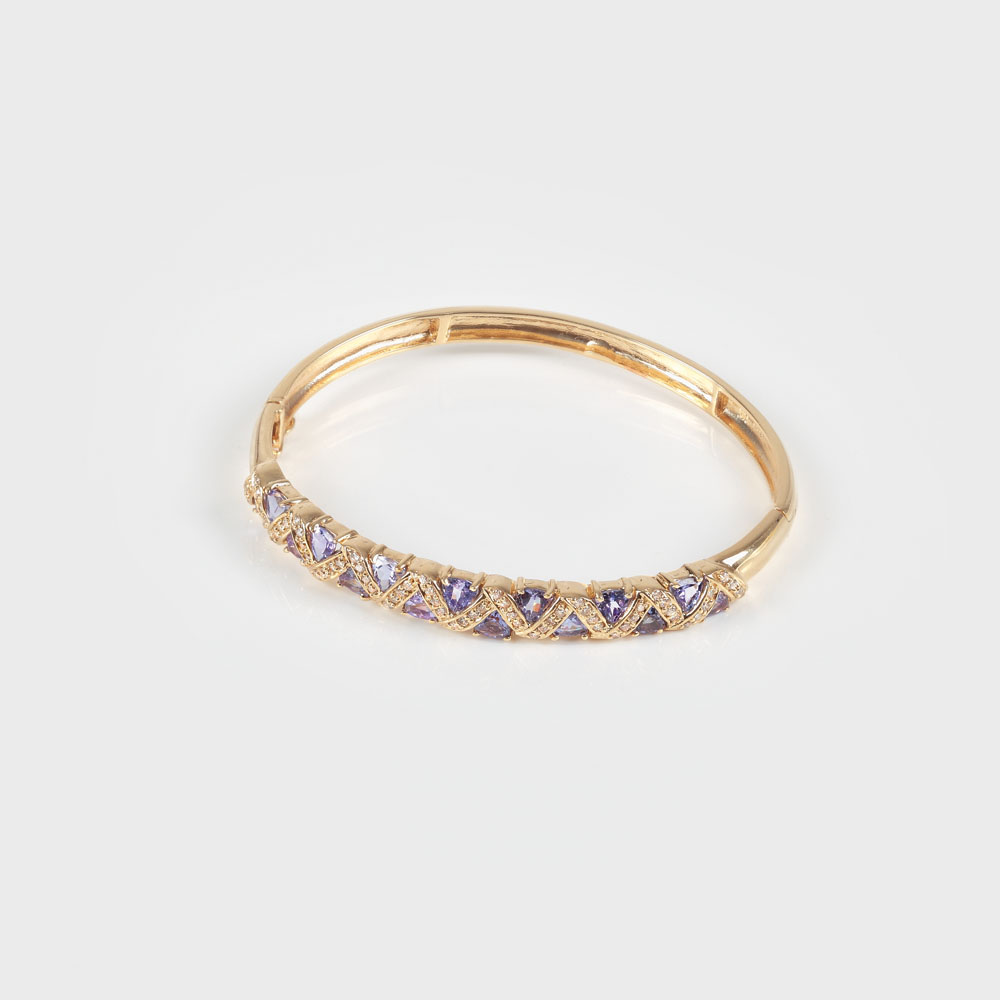 Elegantă brăţară din aur, decorată cu tanzanite şi diamante