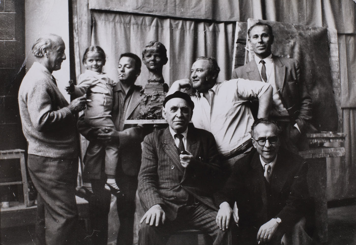 The Sculptor Oscar Han, in his workshop, next to Brunea Fox, Jules Pherahim and Stephan Roll, 1961