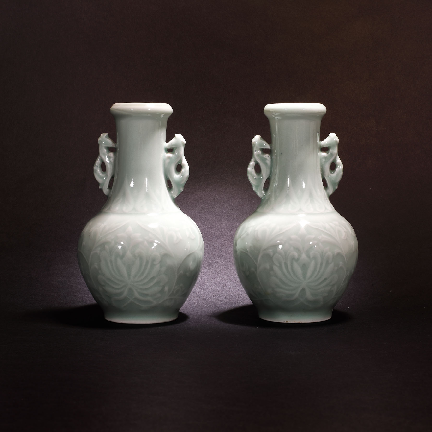 Two vessels with dragon handles, made from celadon glaze porcelain, decorated with chrysanthemums,  the Qing Dynasty Period, China, the 18th-19th century