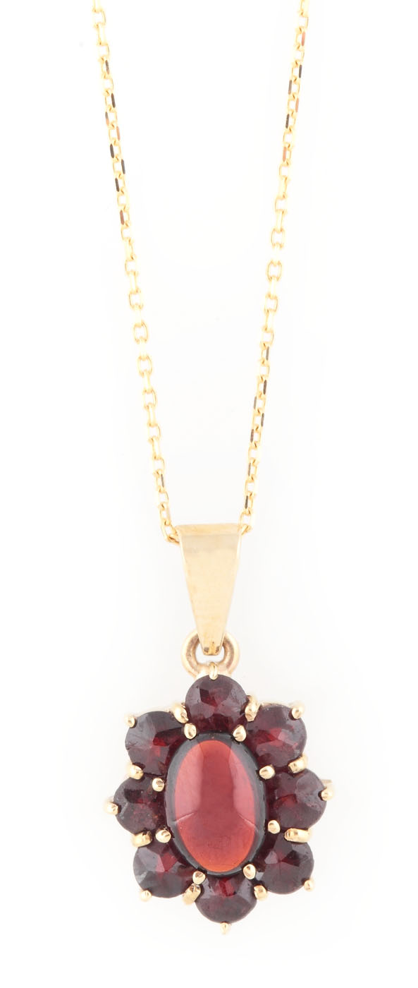 Gold chain and pendant ornate with garnets