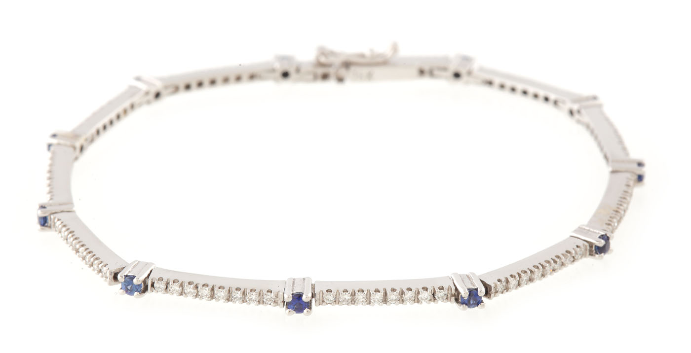 Elegant white gold bracelet, decorated with diamonds and sapphires