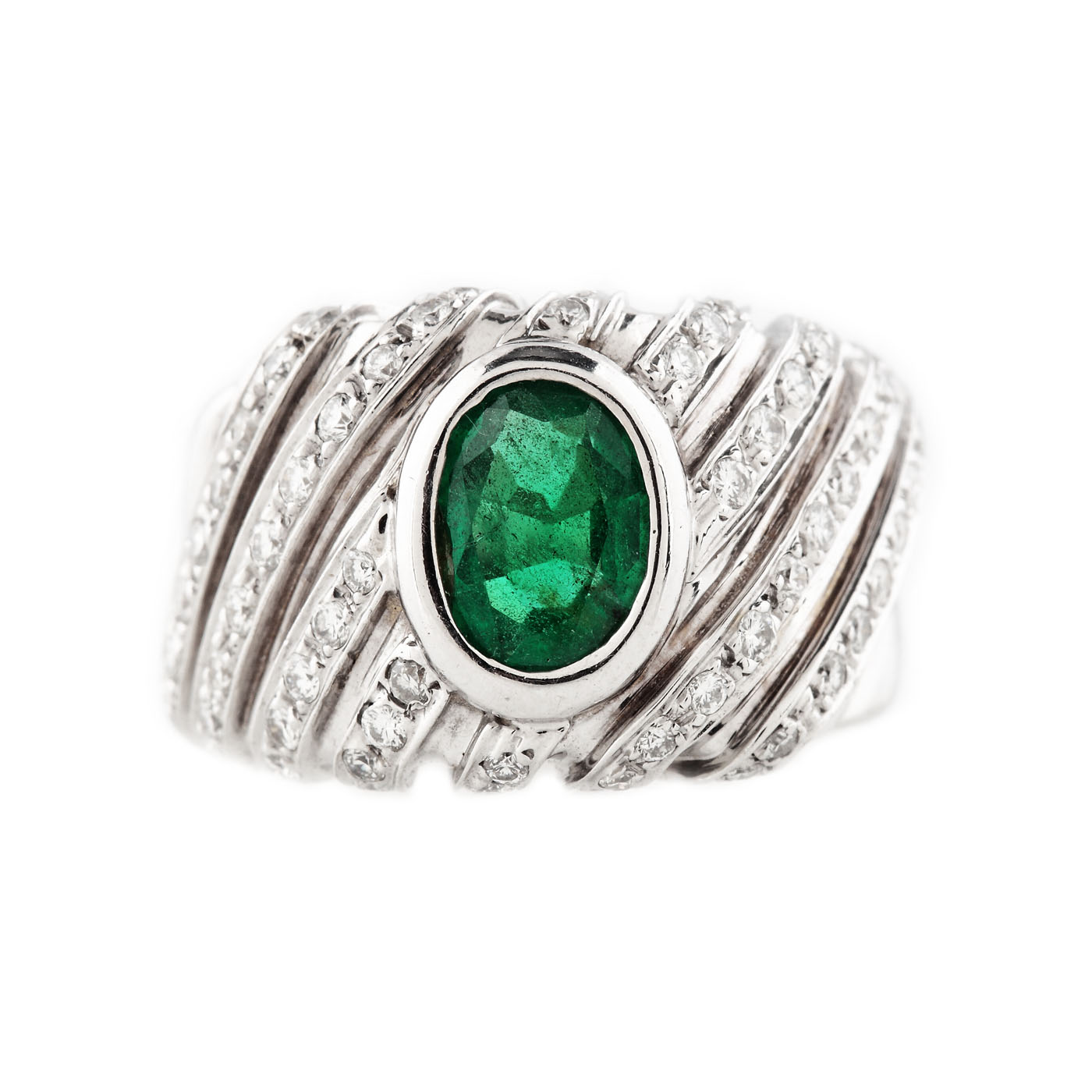 White gold ring, decorated with an emerald and suites of diamonds