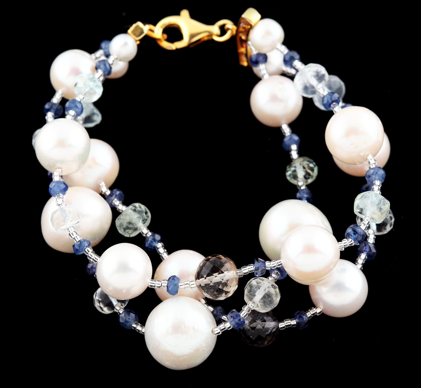 Gilded silver bracelet, decorated with pearls, quartzes, sapphires and rubies
