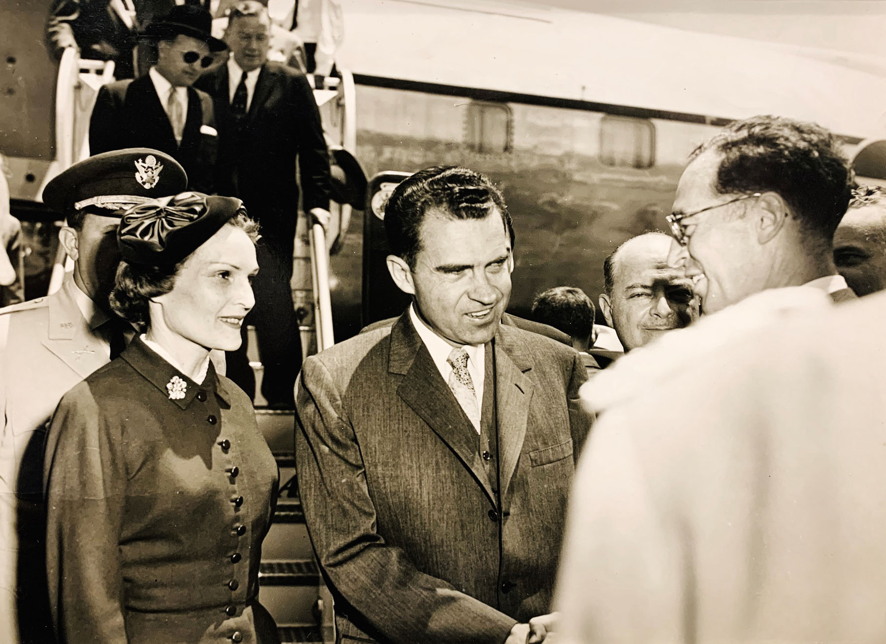 Richard Nixon and his wife Patricia, welcomed by Caracas government officials, Venezuela, just before the violent portests, ca. 1958