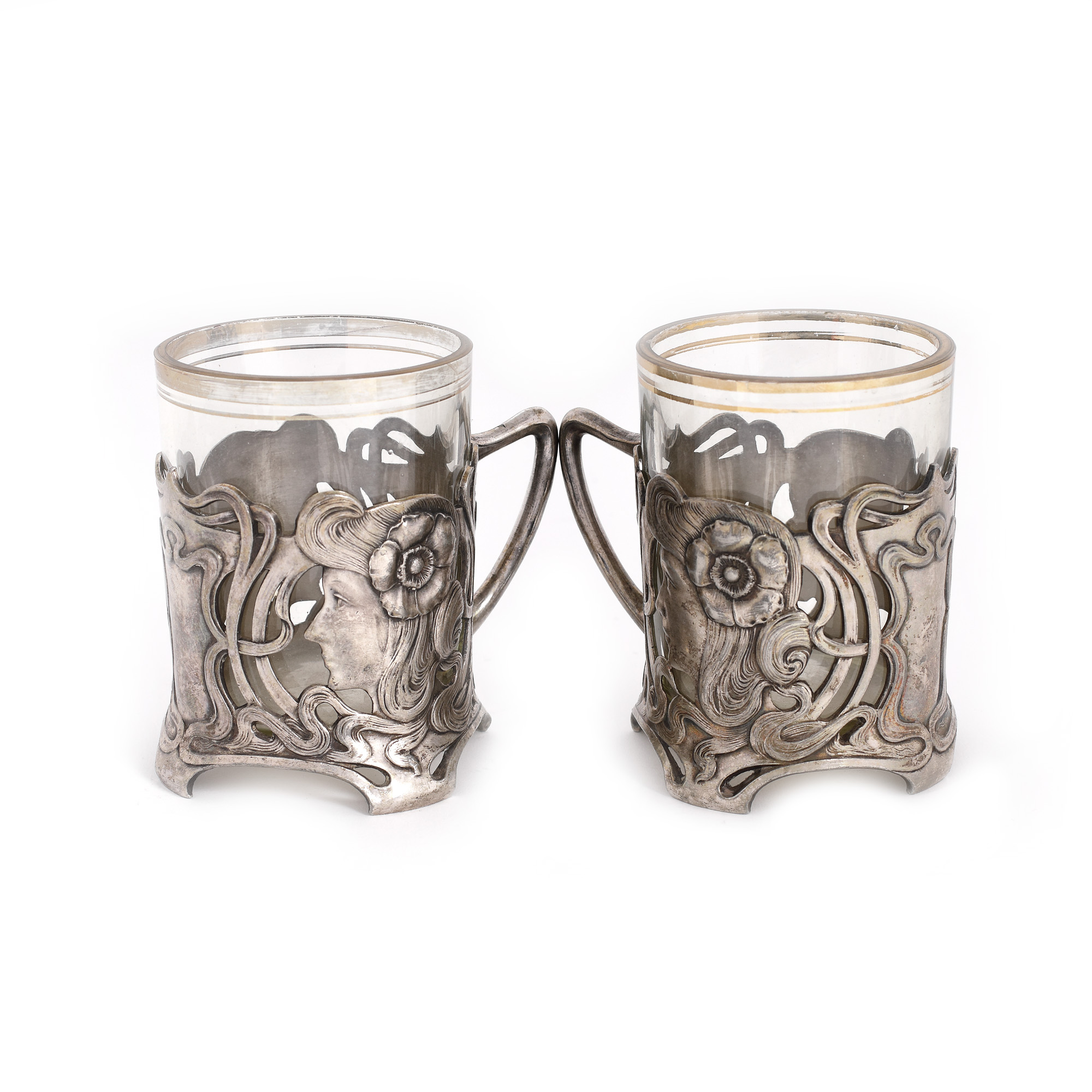 Pereche de pahare WMF, în stil Art Nouveau, decorată cu elemente vegetale și profil de femeie, începutul sec. XX