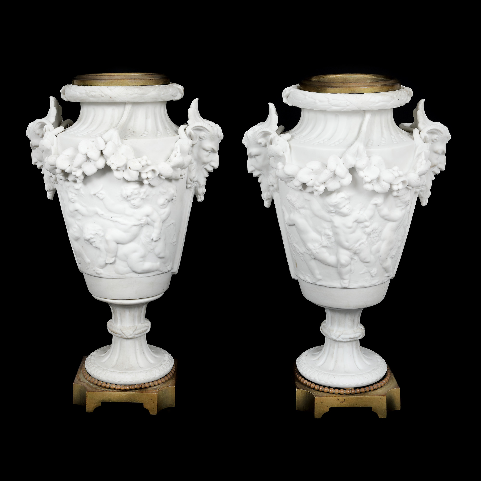 Pair of dishes, biscuit porcelain and bronze, decorated with putti garlands and satyr heads, approx. 1900