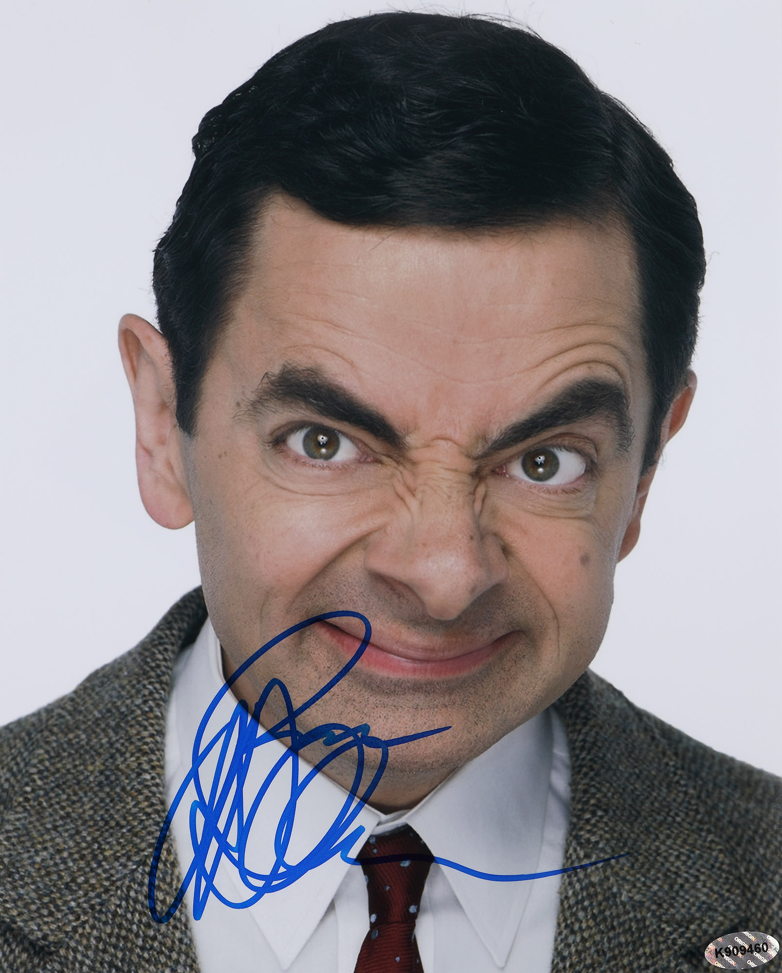 Fotografie ilustrându-l pe Rowan Atkinson, în rolul lui Mr. Bean, cu semnătura olografă a actorului, însoțită de certificatul de autenticitate