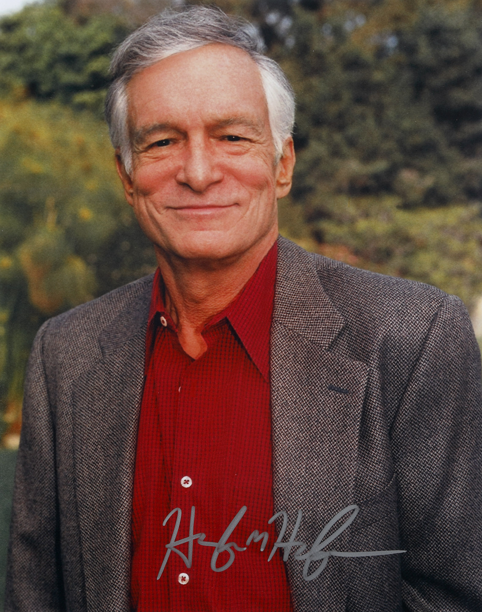 Fotografie ilustrându-l pe Hugh Hefner, fondatorul revistei Playboy, cu semnătura olografă, însoțită de certificatul de autenticitate