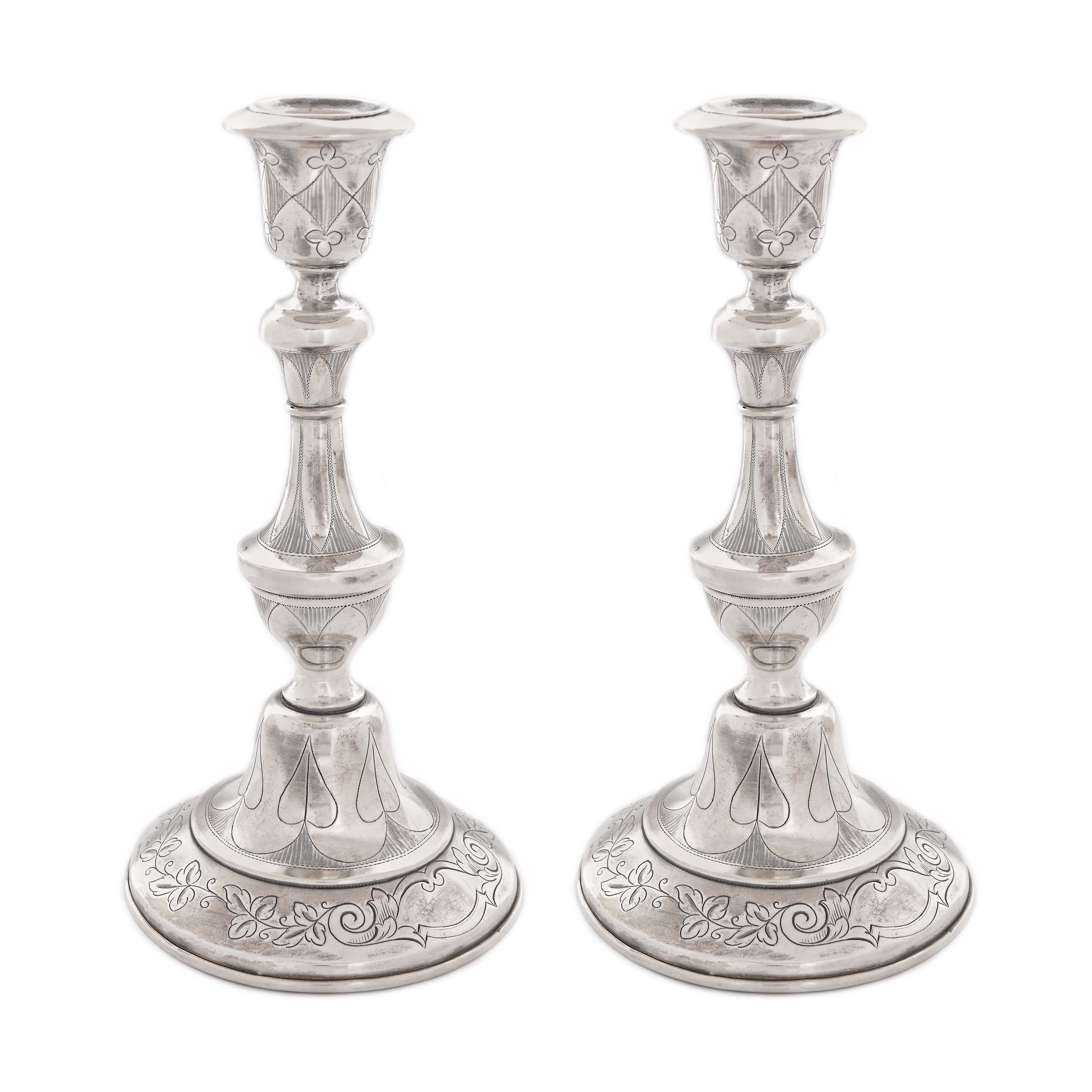 Pair of silver candlesticks with engraved plant decoration, approx. 1850