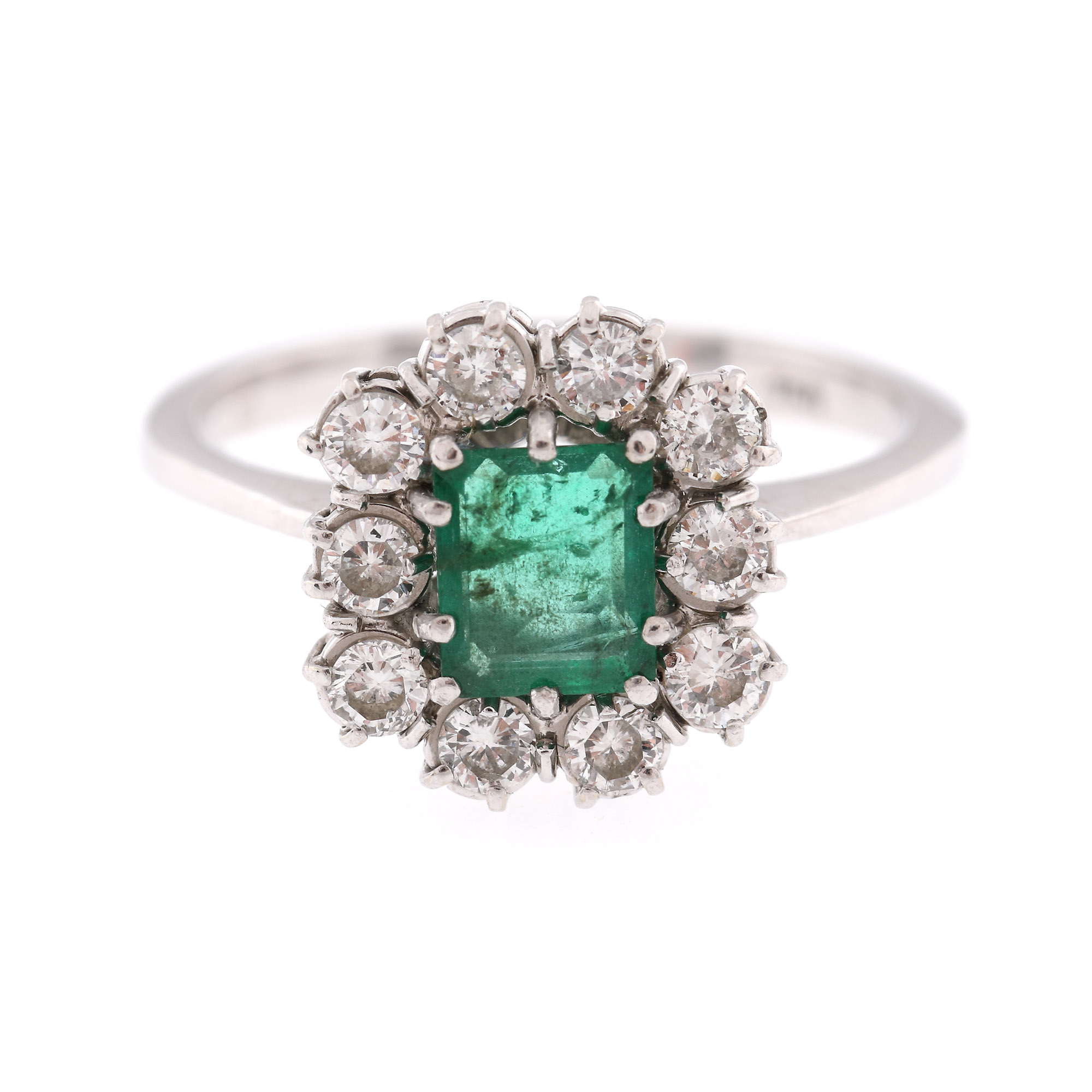 White gold ring, decorated with emerald and diamonds