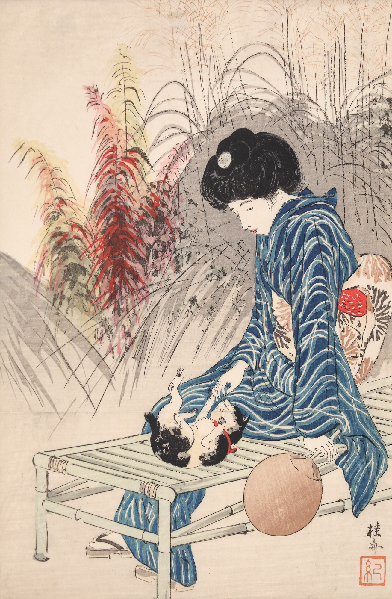Young woman playing with a cat