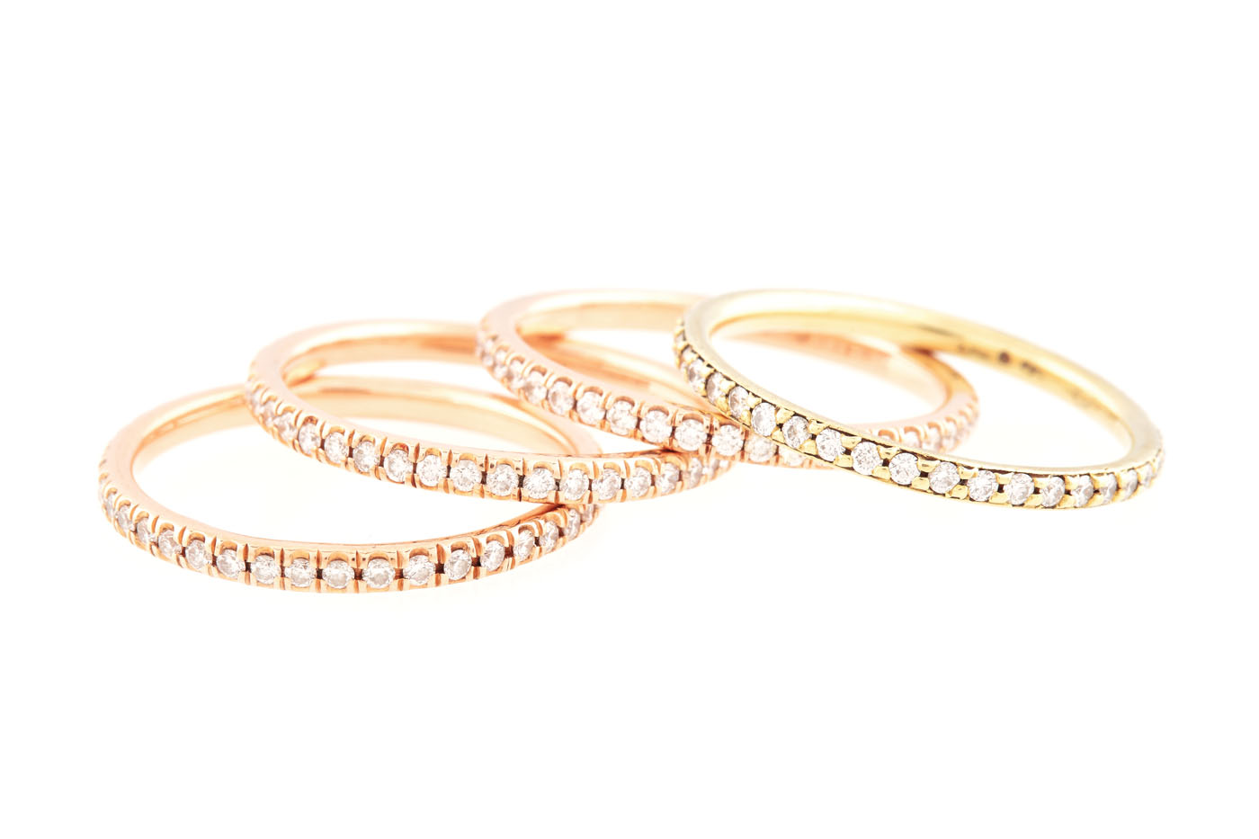 Set consisting of four Sam Lehr gold rings set with diamonds