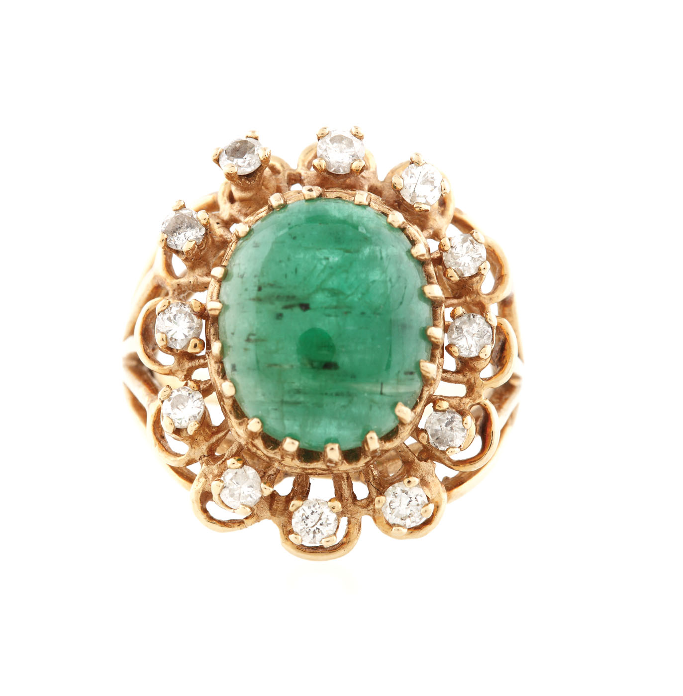Gold ring set with emerald and diamonds