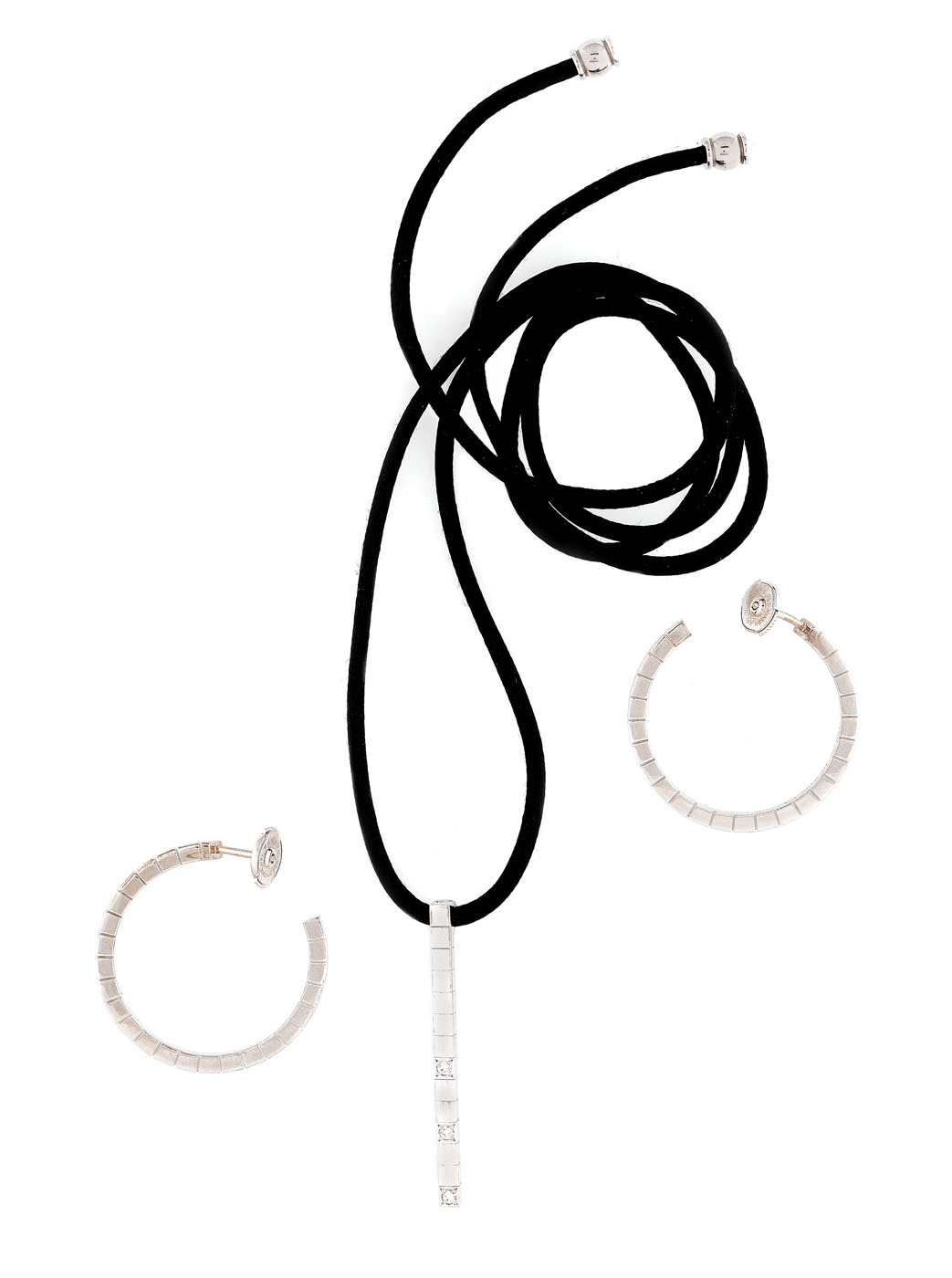 Cartier white gold set comprising a necklace and a pair of earrings set with diamonds