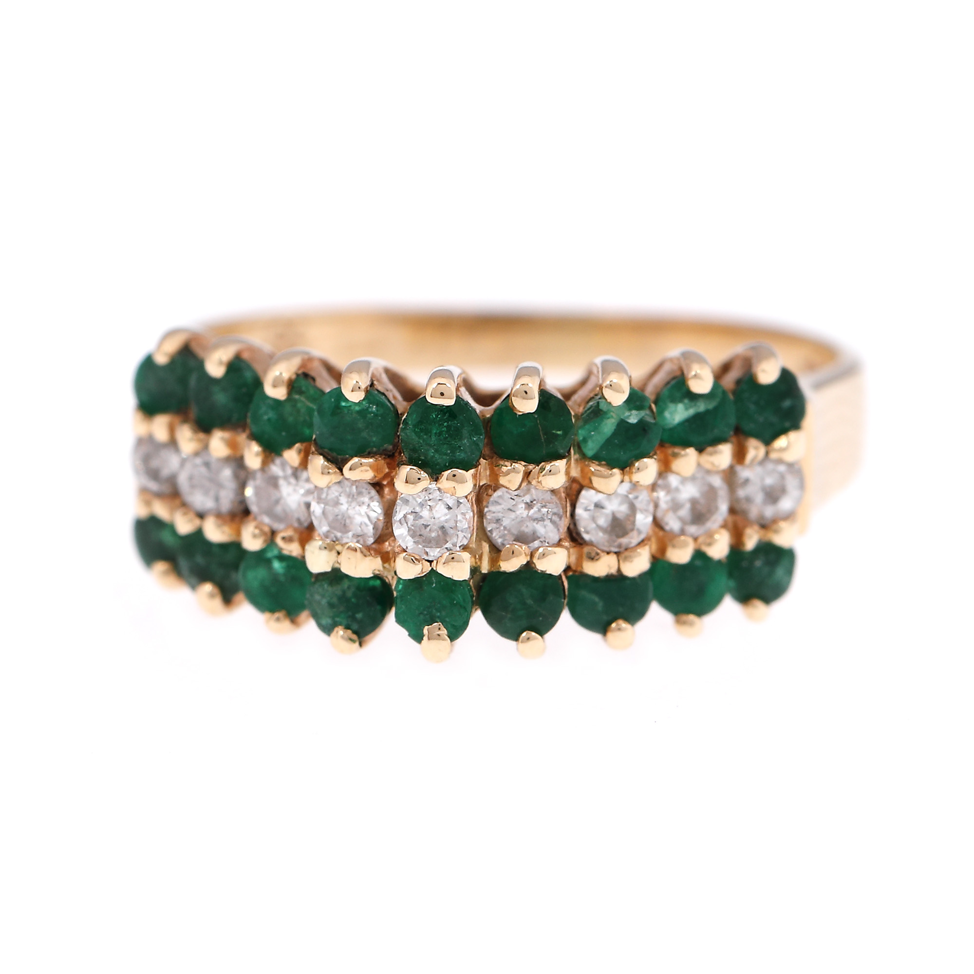 Gold ring, adorned with emeralds and diamonds